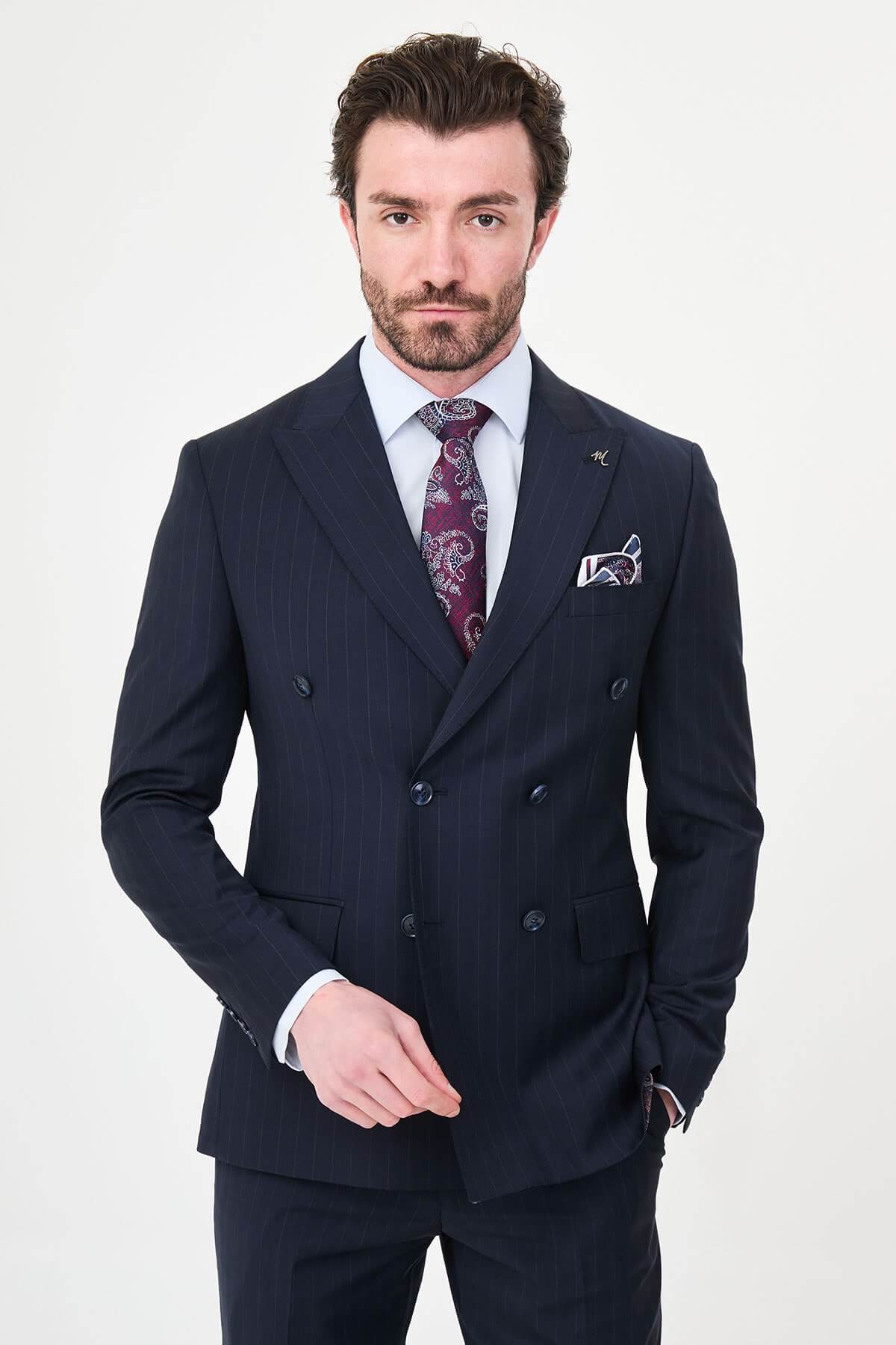 Hollomen Navy Blue Pinstripe Double-Breasted Slim Fit Premium Wool Suit on a male model, styled with a burgundy patterned tie and matching pocket square.