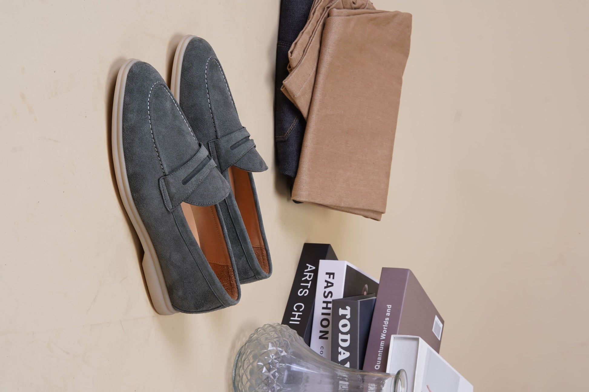 Men’s pale cyan mist suede leather penny loafers with classic strap detail and lightweight cream sole.