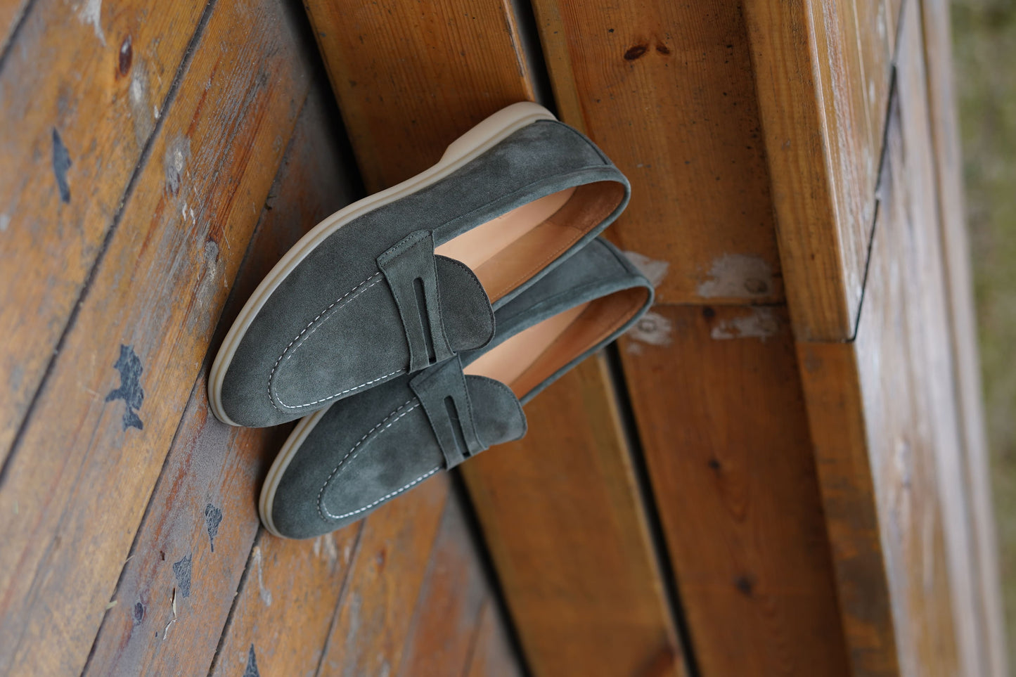 Men’s pale cyan mist suede leather penny loafers with classic strap detail and lightweight cream sole.