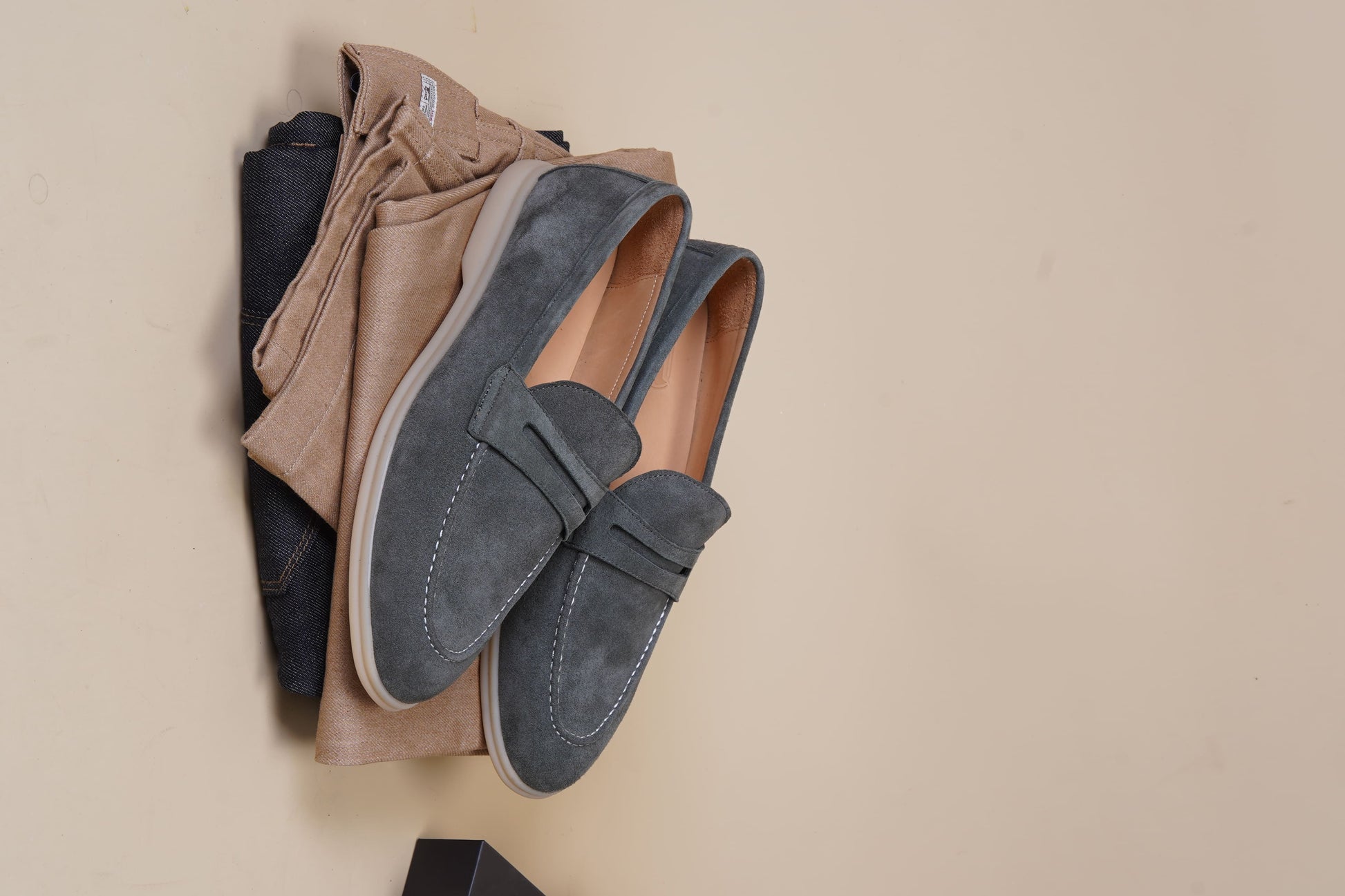 Men’s pale cyan mist suede leather penny loafers with classic strap detail and lightweight cream sole.