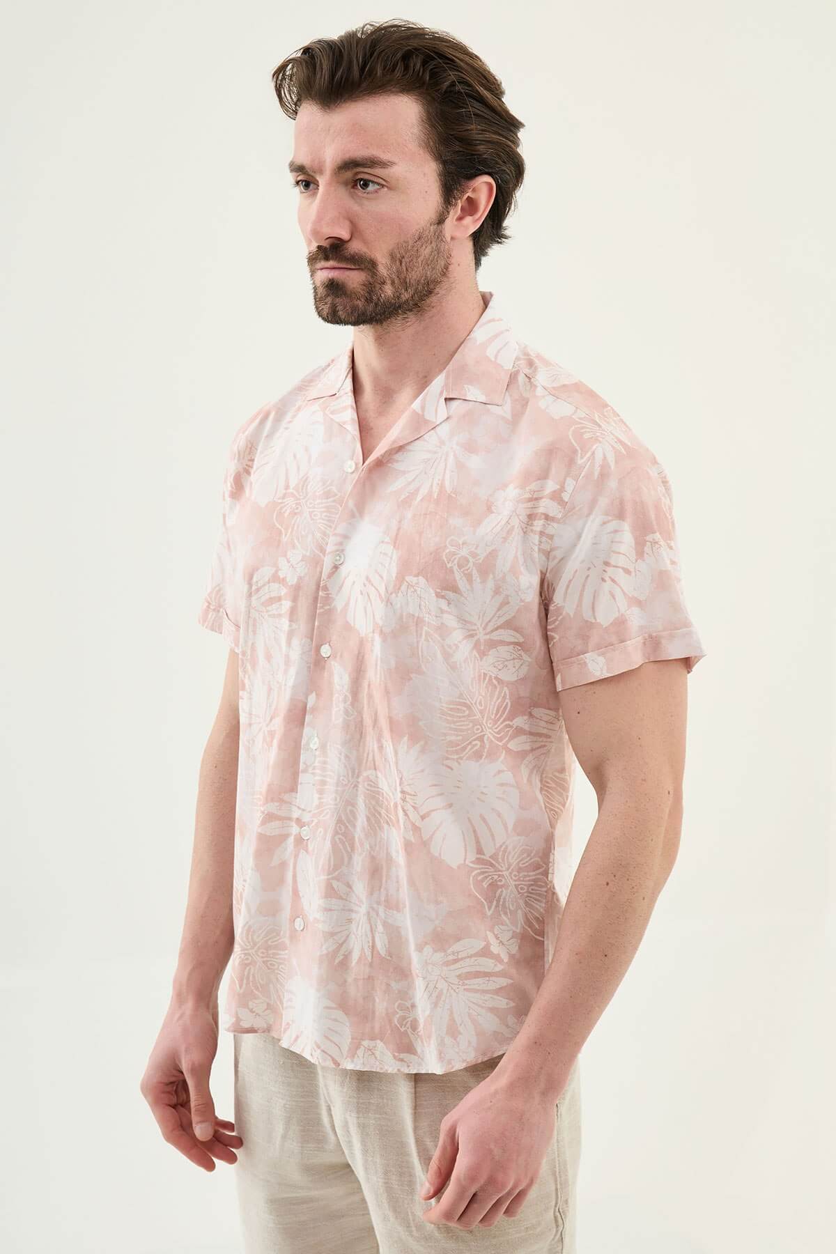 Men’s pink tropical print short sleeve shirt crafted from lightweight 100% cotton, designed for relaxed summer and resort styling.