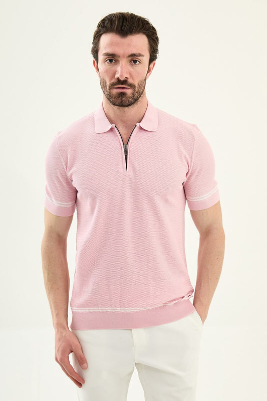Man wearing a pink slim-fit quarter-zip polo T-shirt, short sleeves, standing against a neutral background, styled for summer casual wear.