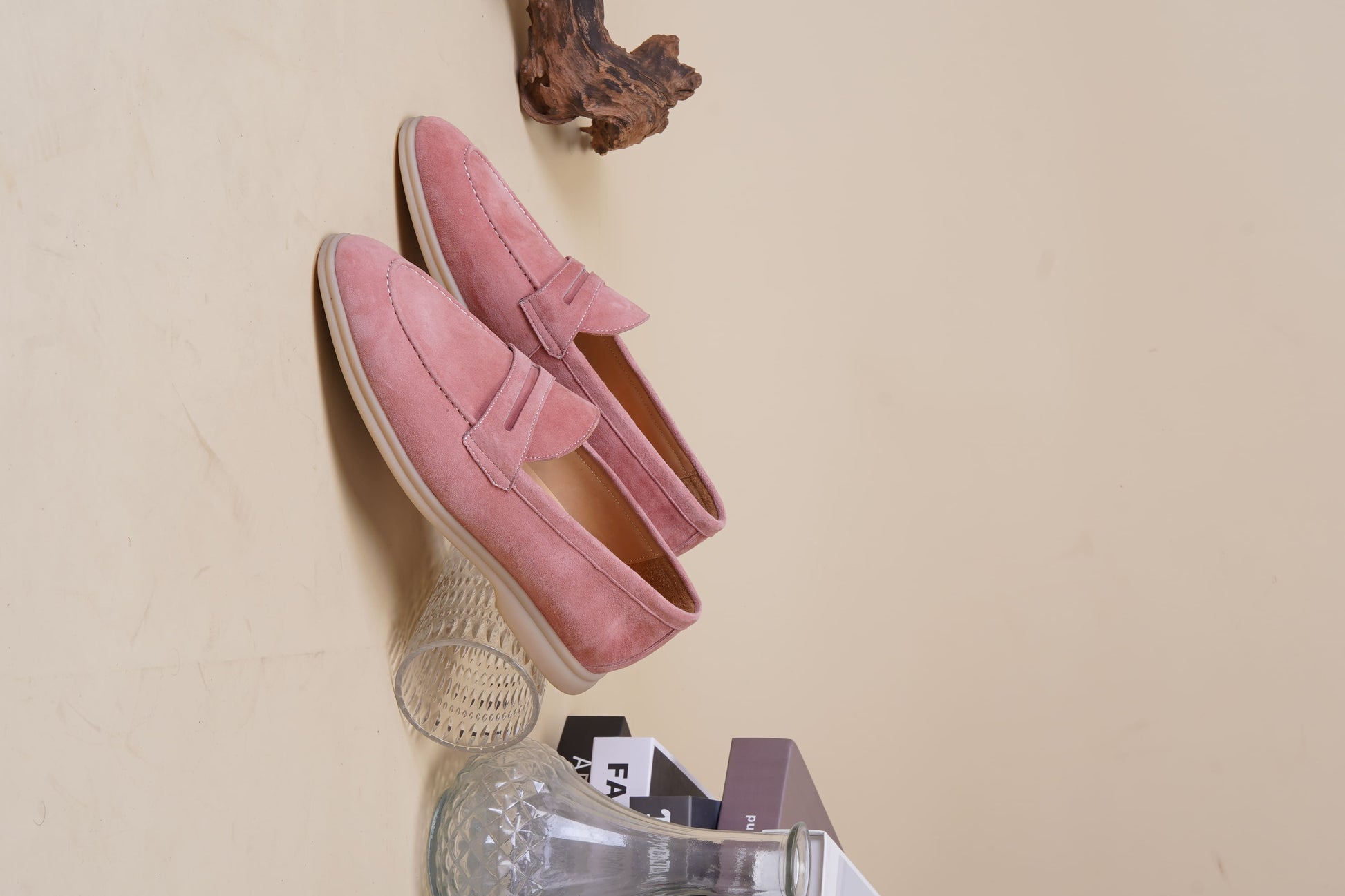 Men’s pink suede leather penny loafers with classic vamp strap detail and lightweight sole.