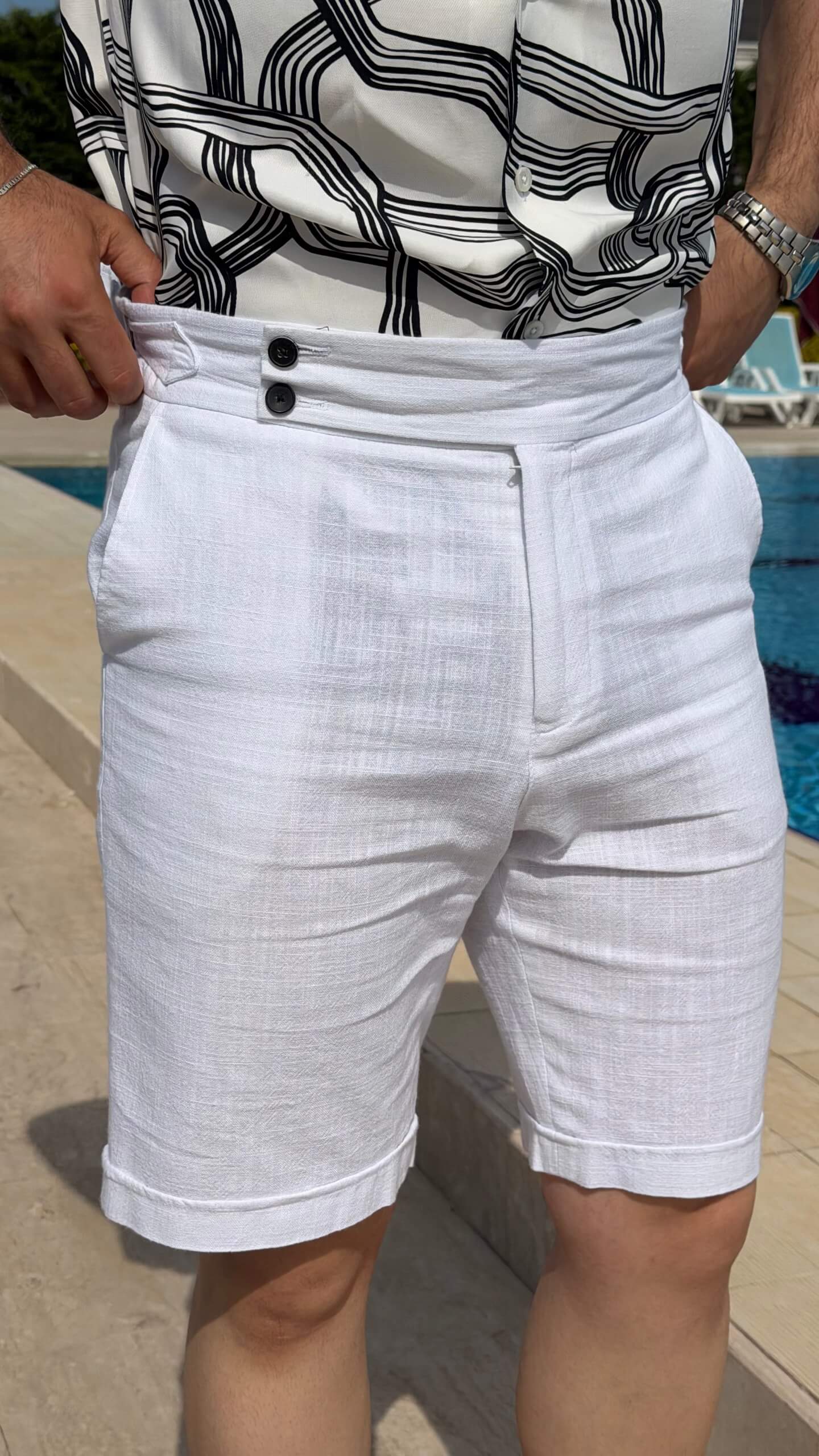 Men’s white linen shorts with tailored fit, button fastening, belt loops, and lightweight summer design.