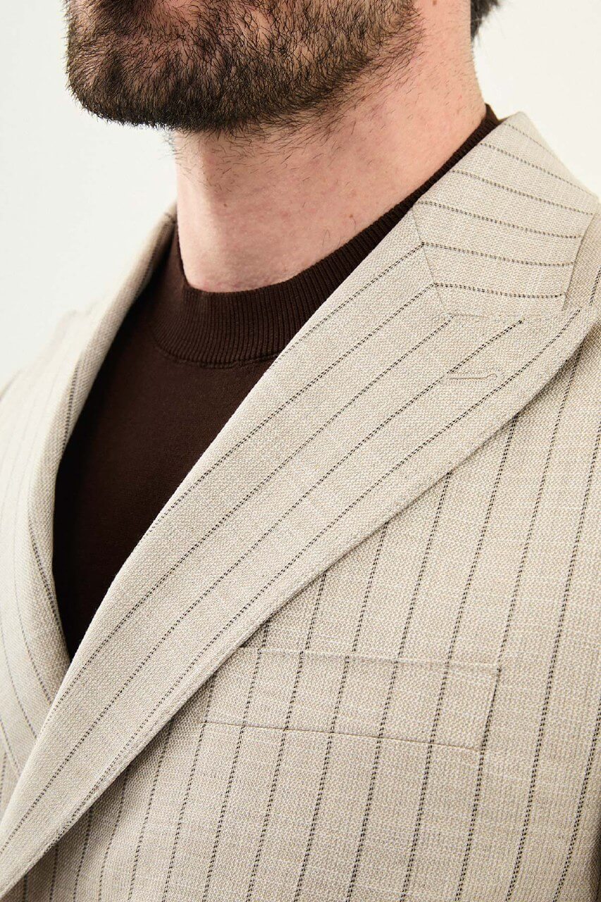 Men’s beige slim fit double-breasted pinstripe suit jacket crafted from a cotton-viscose stretch blend for elegant formal and smart occasion wear.