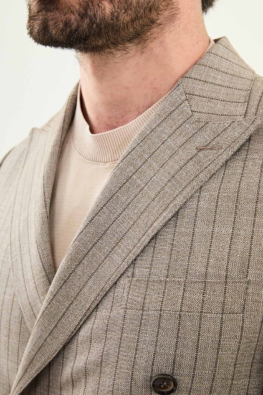 Men’s brown slim fit double-breasted pinstripe suit jacket crafted from a cotton-viscose stretch blend for modern formal and smart occasion wear.