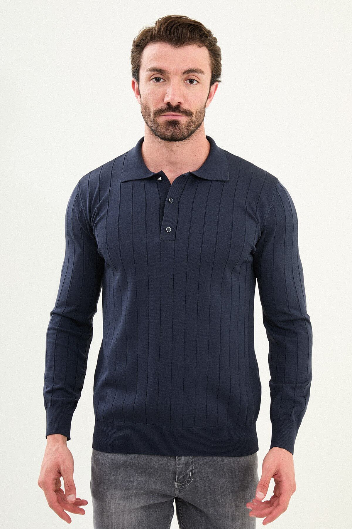 Men’s navy blue ribbed polo sweater with vertical knit pattern, slim fit smart casual knit styled with gray trousers