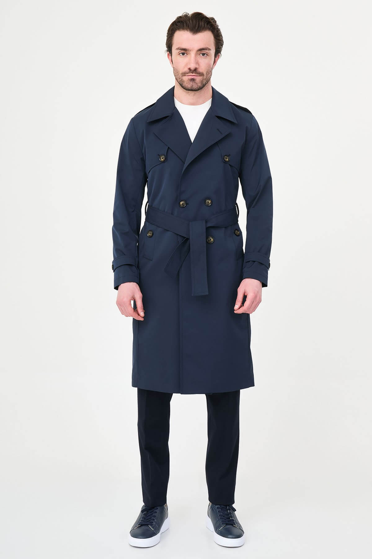 Men’s navy blue double breasted trench coat with belt and tailored fit for fall winter style