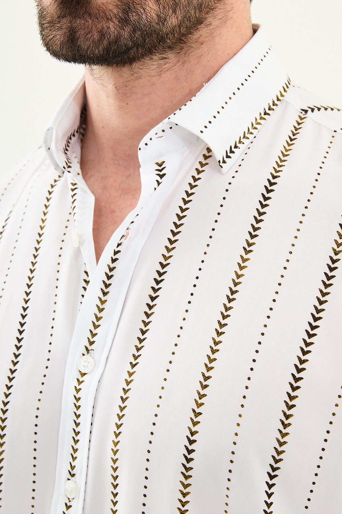 men’s slim-fit long sleeve shirt in white with brown patterned stripes, worn tucked casually with beige trousers.
