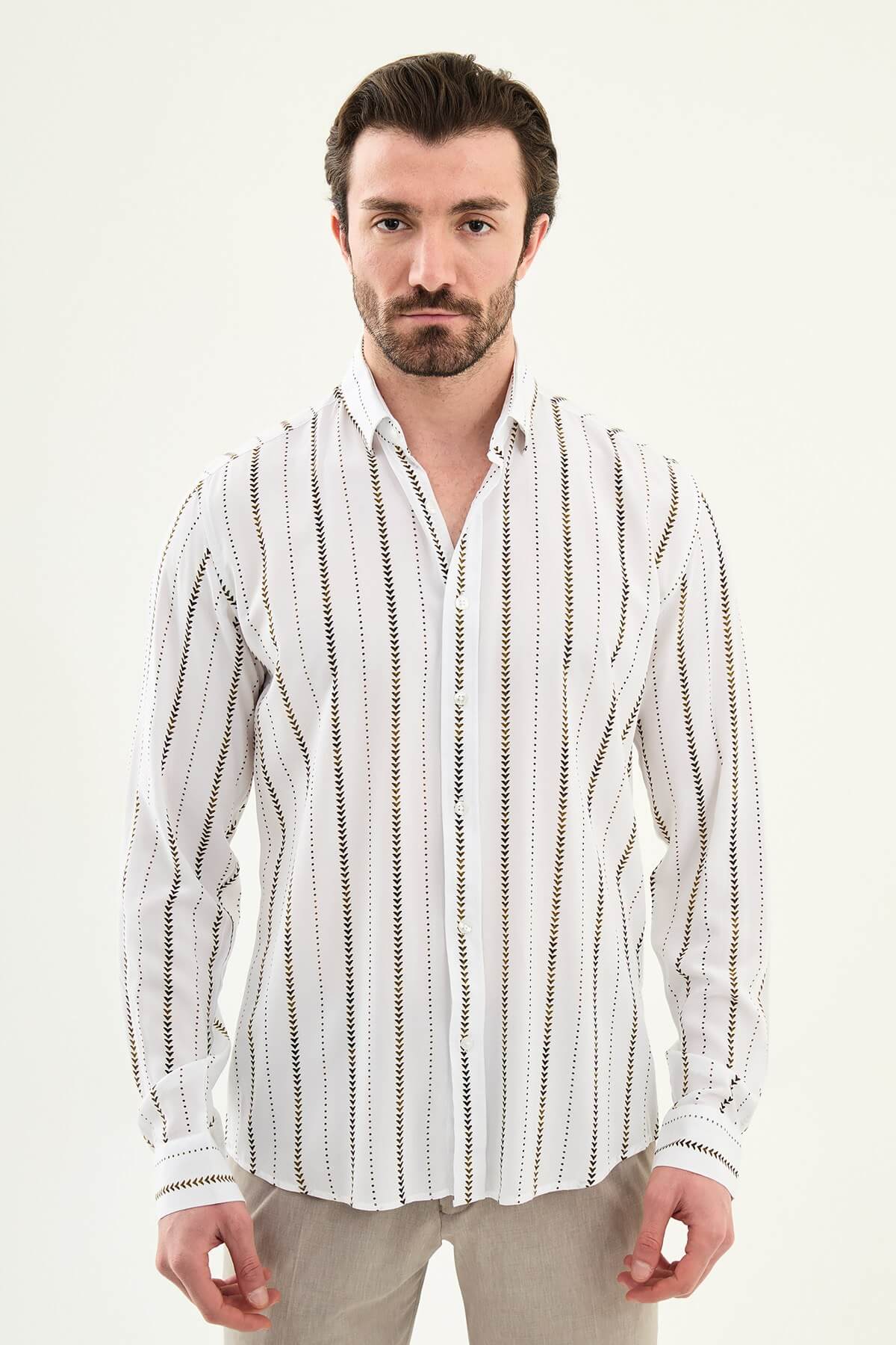 men’s slim-fit long sleeve shirt in white with brown patterned stripes, worn tucked casually with beige trousers.
