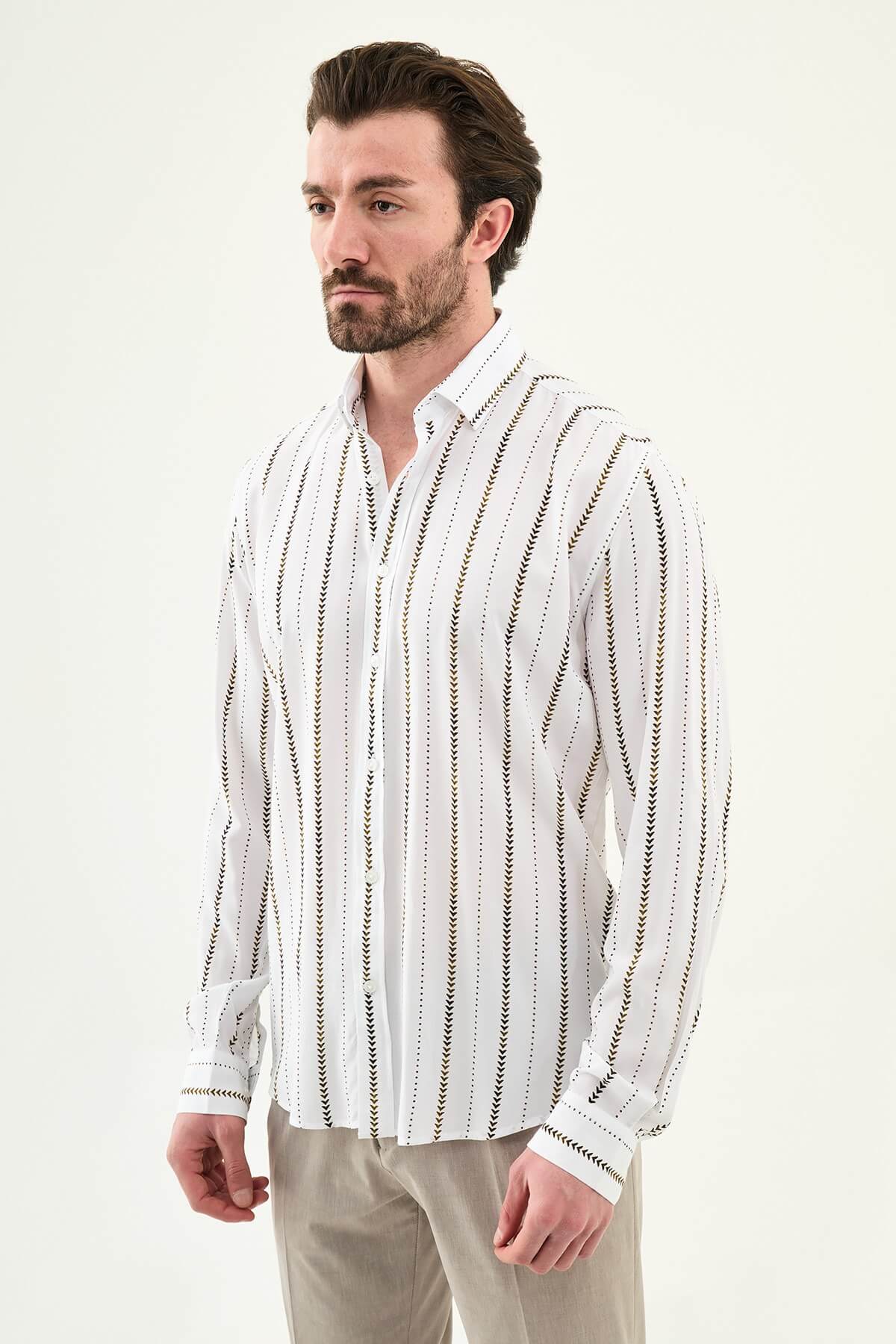 men’s slim-fit long sleeve shirt in white with brown patterned stripes, worn tucked casually with beige trousers.