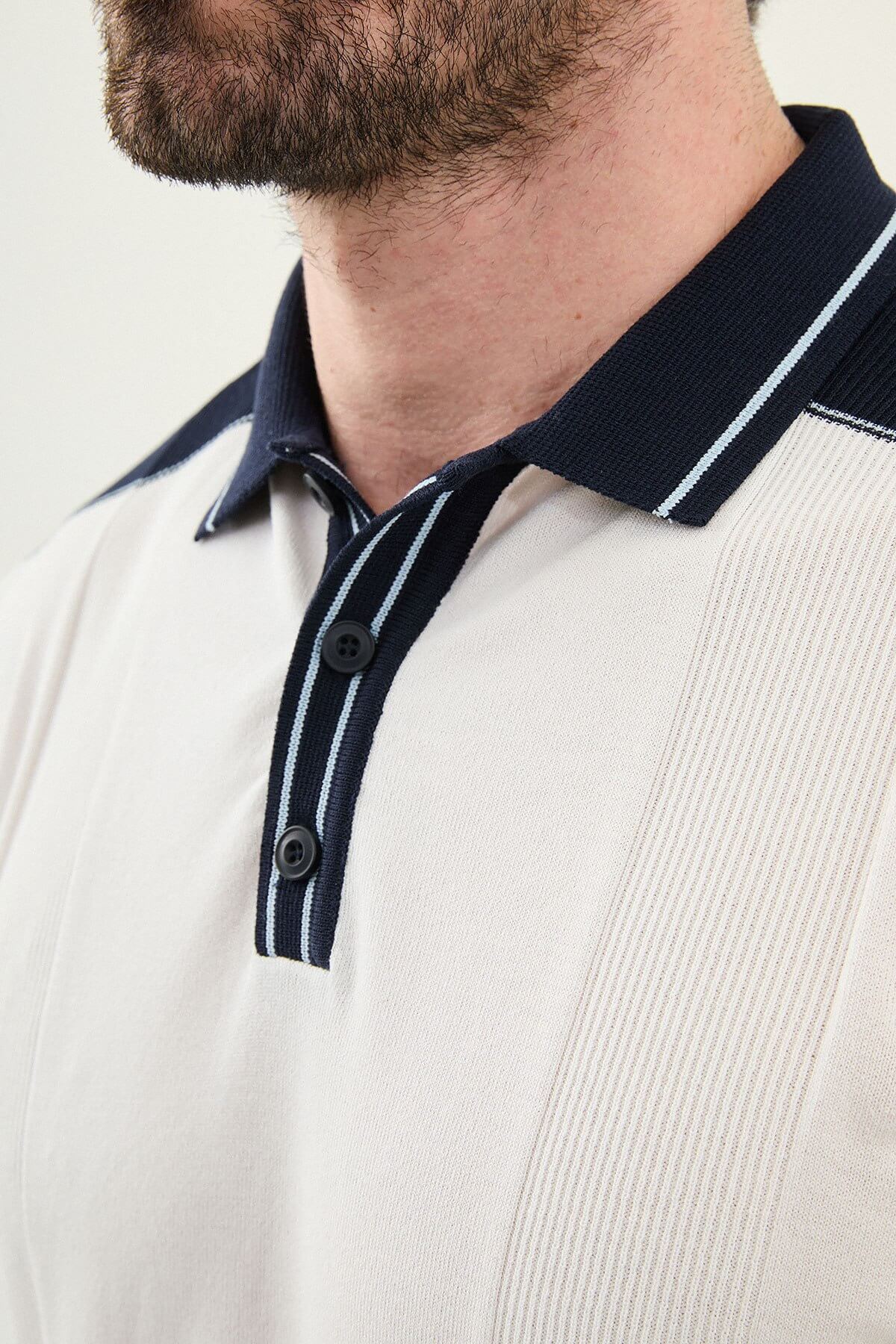 Men’s white colorblock slim fit knit polo shirt with contrast collar details styled for elegant summer smart-casual fashion.