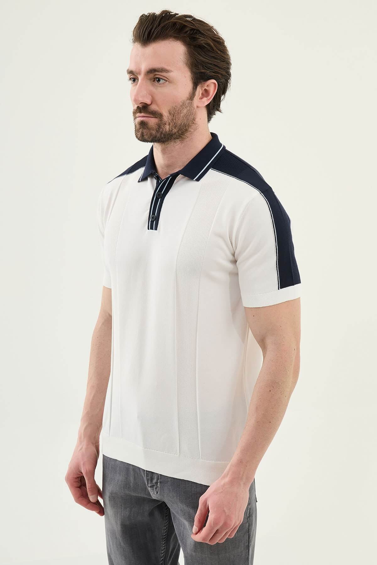 Men’s white colorblock slim fit knit polo shirt with contrast collar details styled for elegant summer smart-casual fashion.