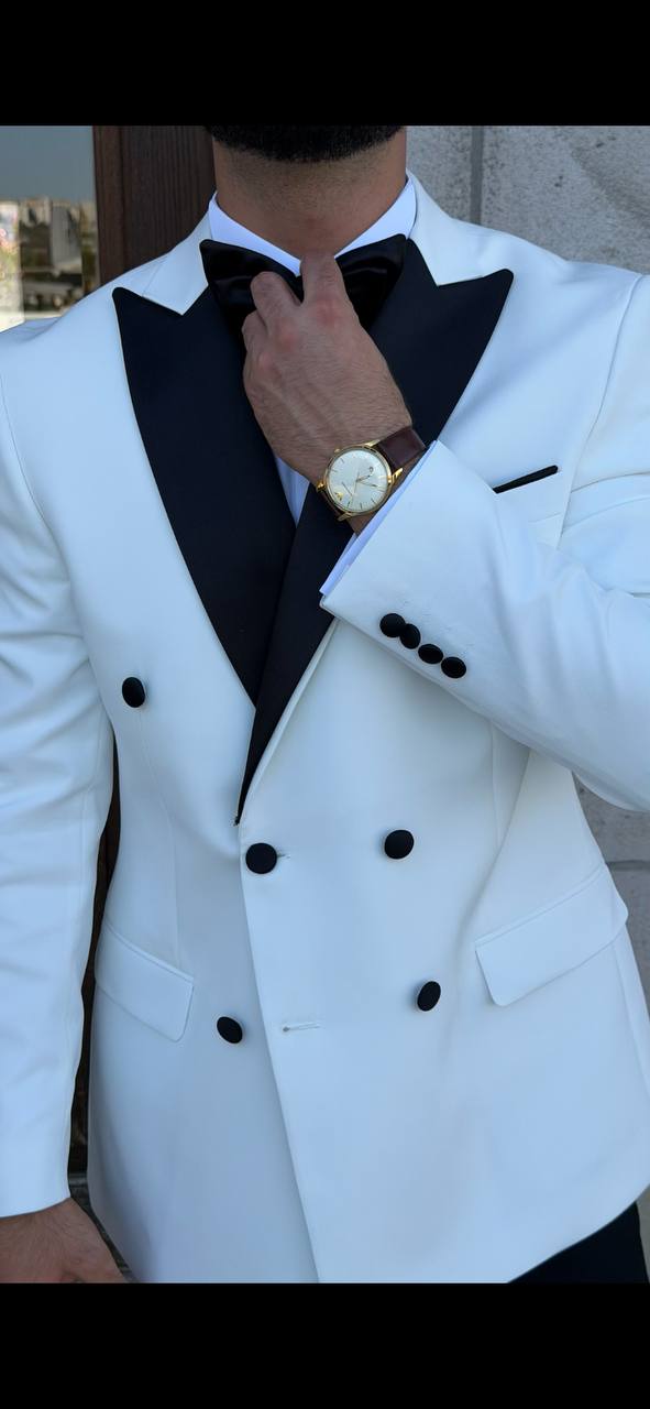 Men’s white double breasted tuxedo suit with black lapels for wedding and formal evening occasions