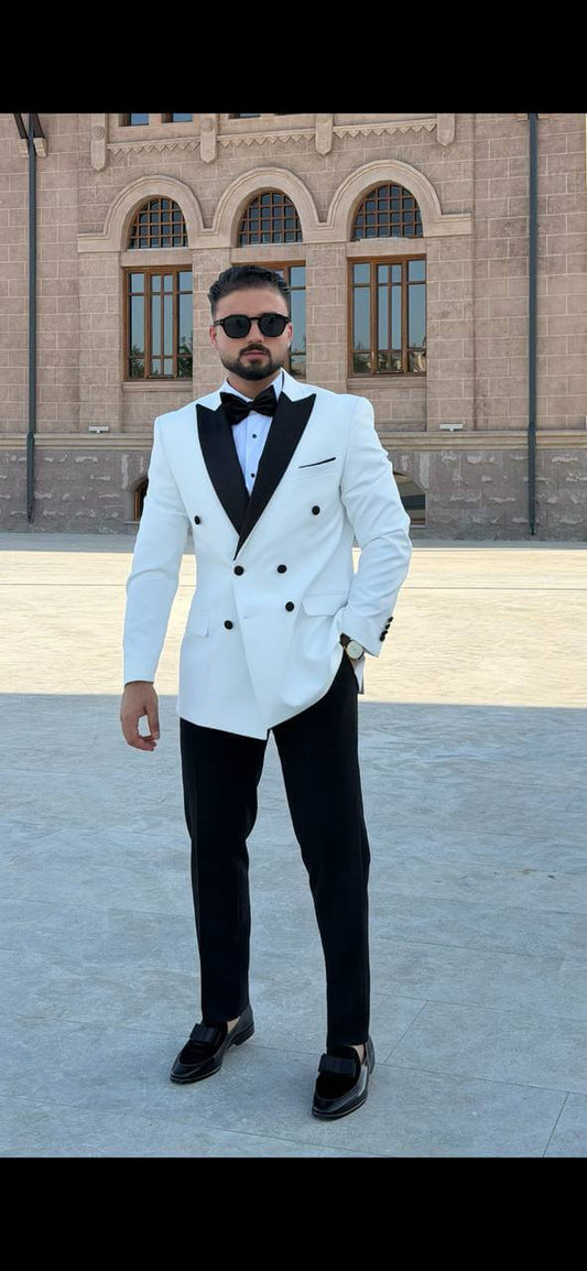 Men’s white double breasted tuxedo suit with black lapels for wedding and formal evening occasions