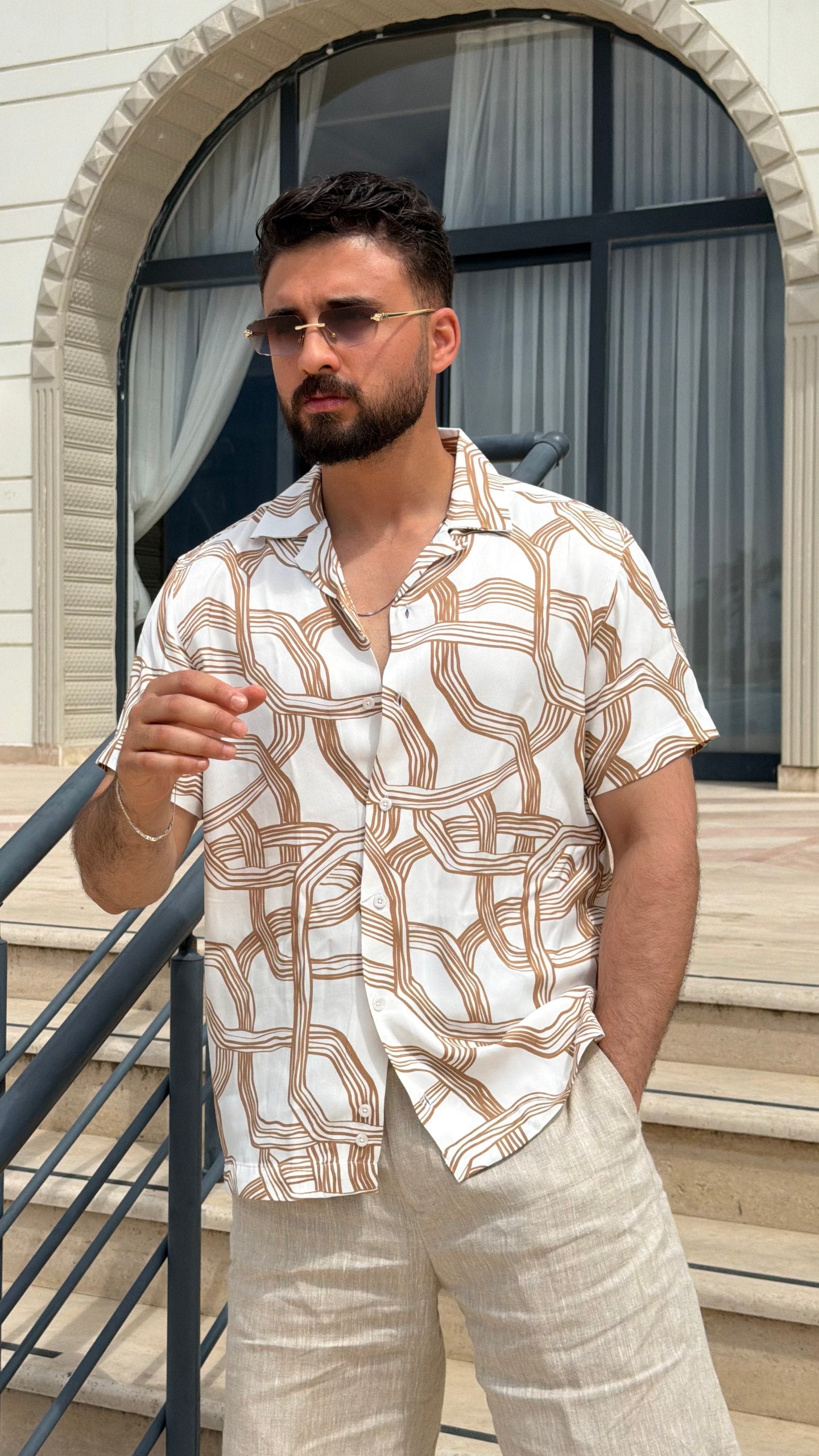Men’s white brown abstract print short sleeve shirt with lightweight viscose fabric, button-front design, and modern summer casual style.