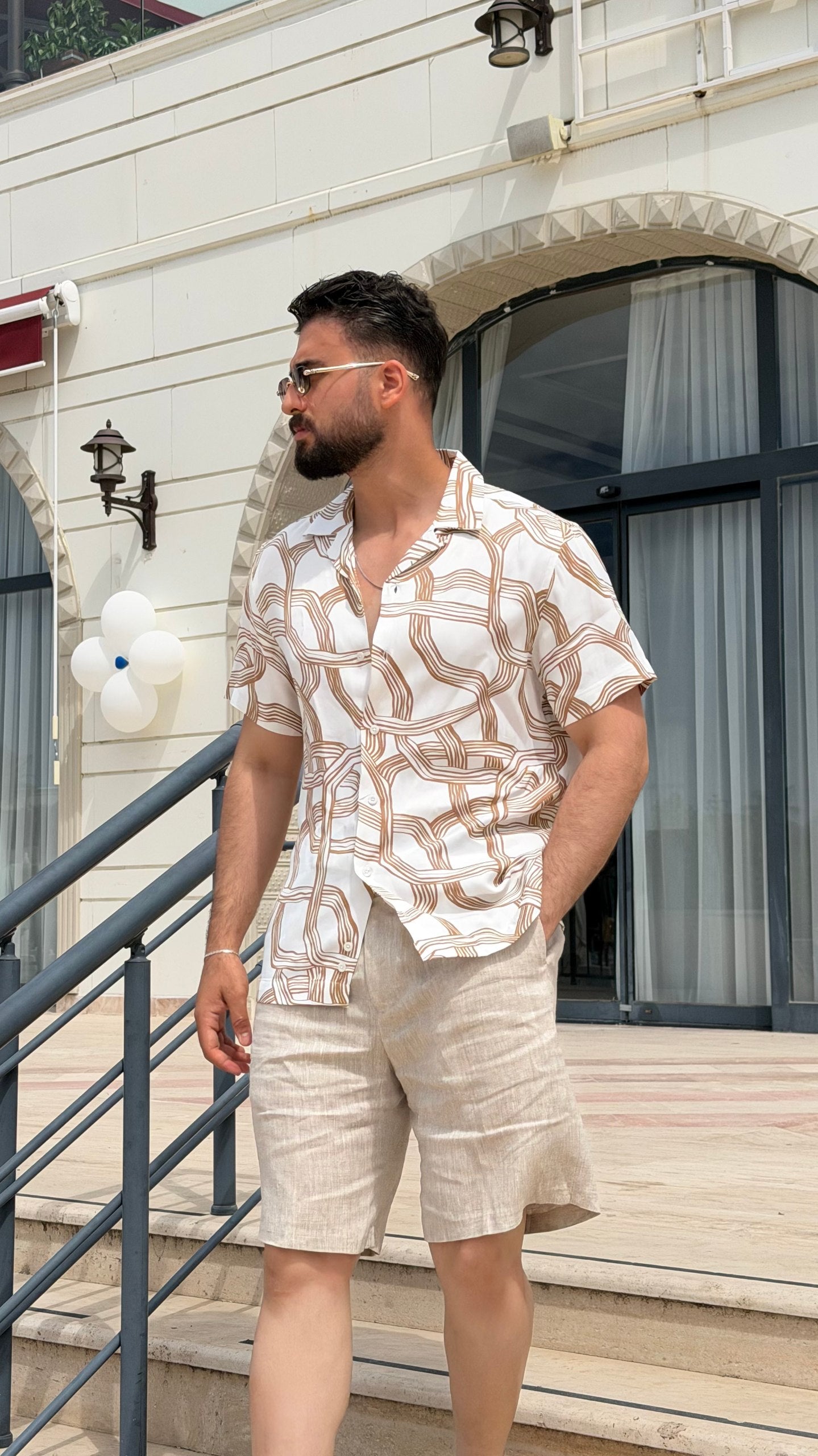 Men’s white brown abstract print short sleeve shirt with lightweight viscose fabric, button-front design, and modern summer casual style.