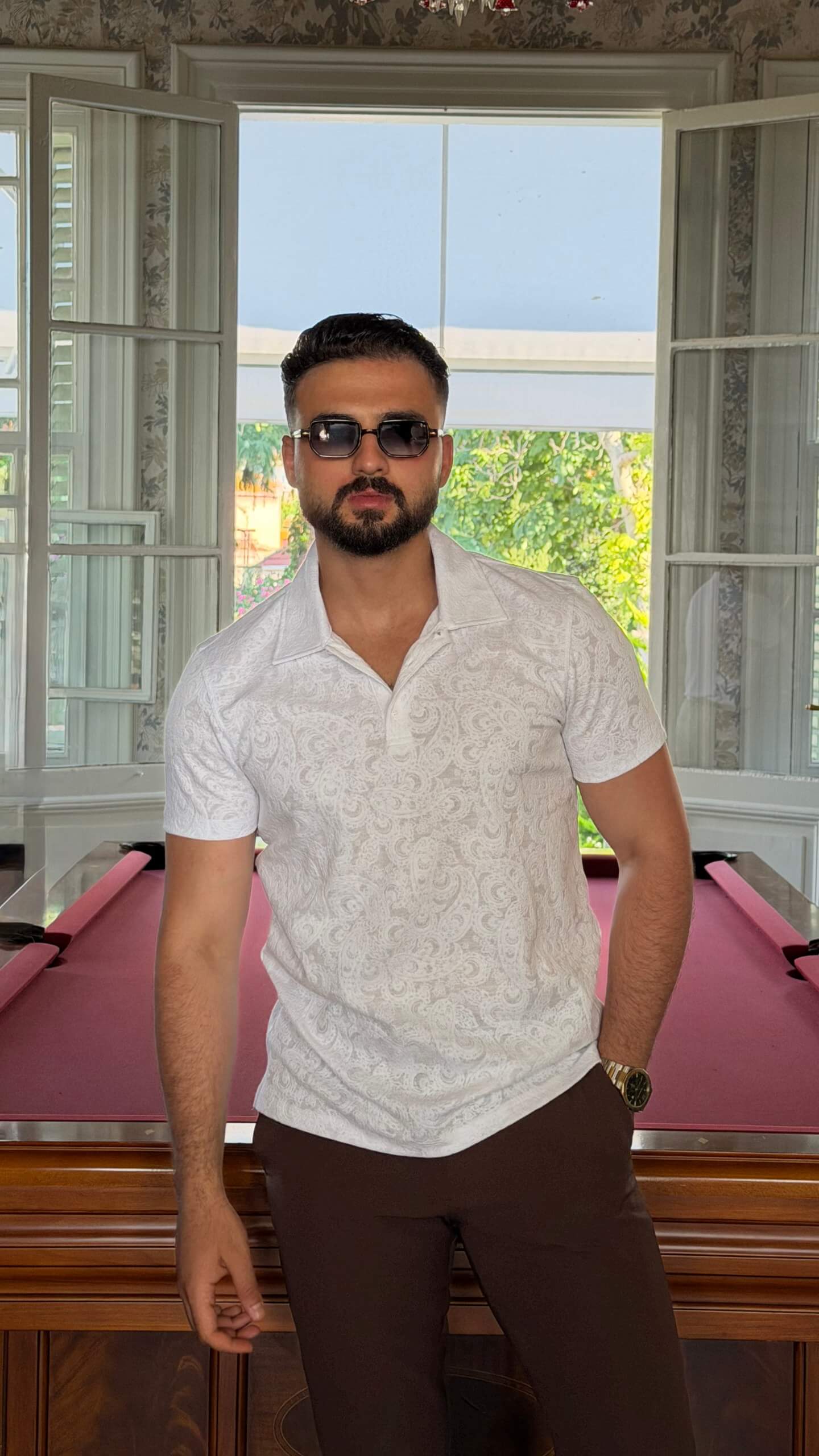 Men's white paisley jacquard polo shirt with textured pattern for summer style