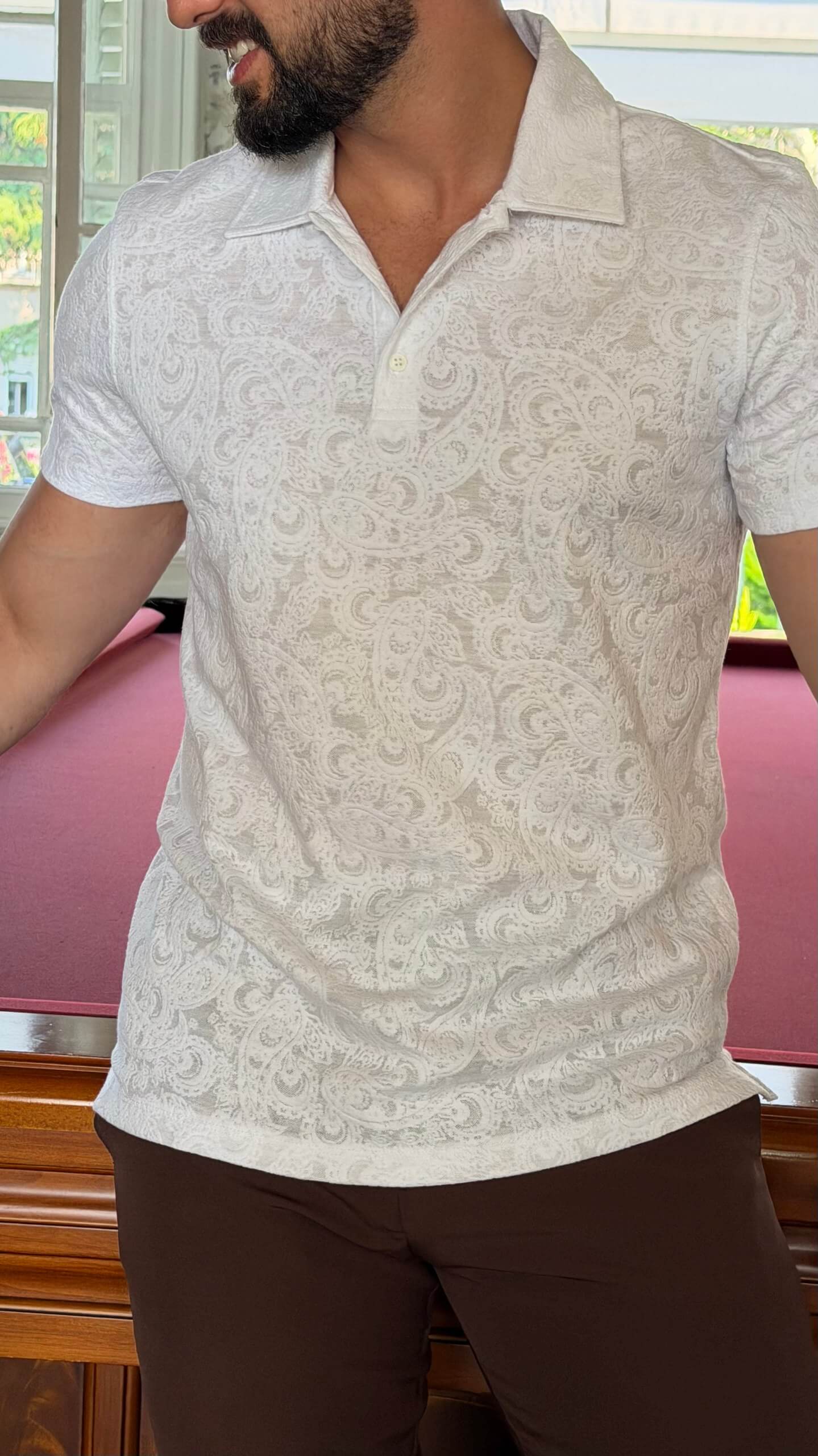 Men's white paisley jacquard polo shirt with textured pattern for summer style