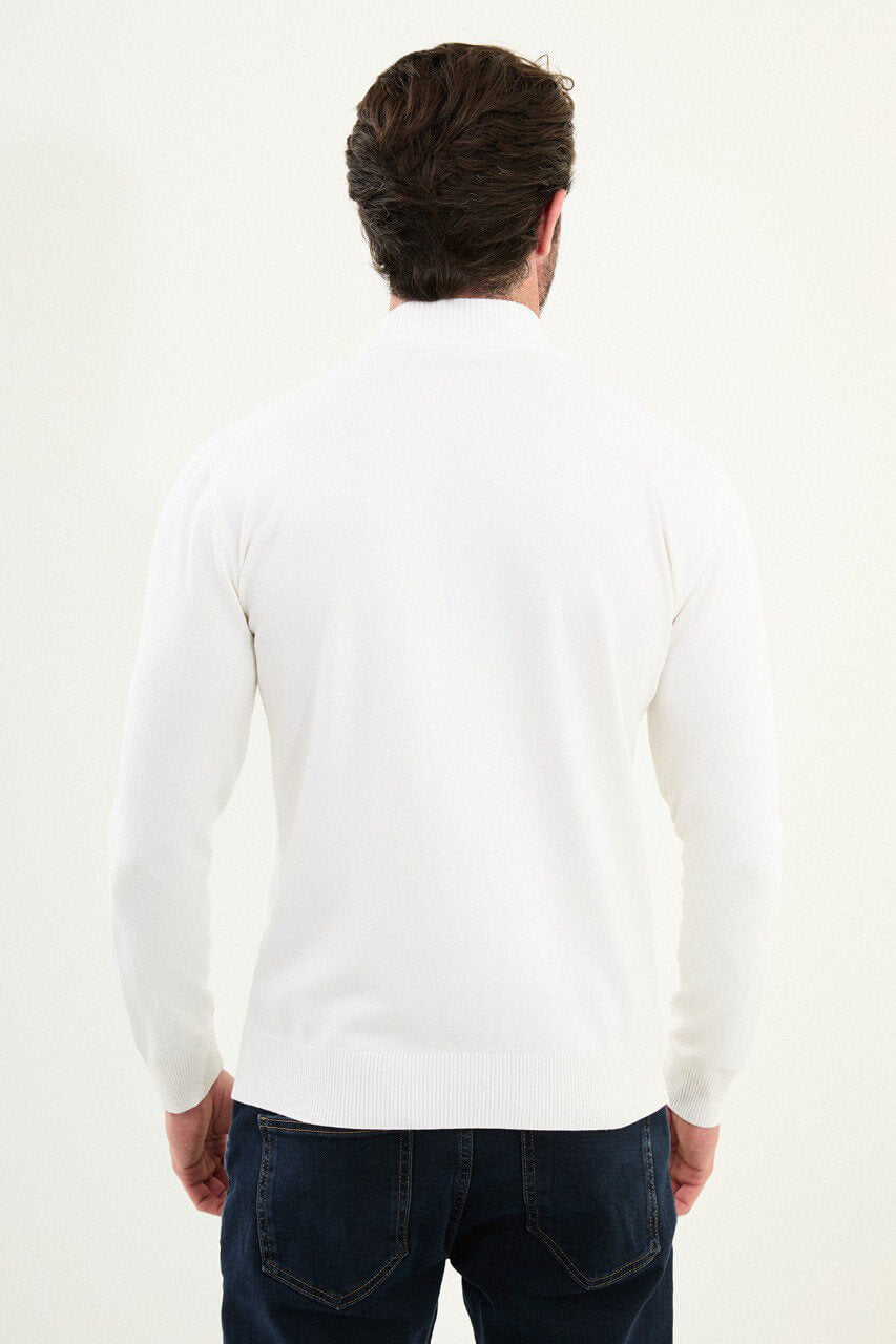 Men’s bright white slim-fit ribbed mock-neck cotton-blend sweater with multi-directional ribbing and diagonal chest panel, styled with dark denim.