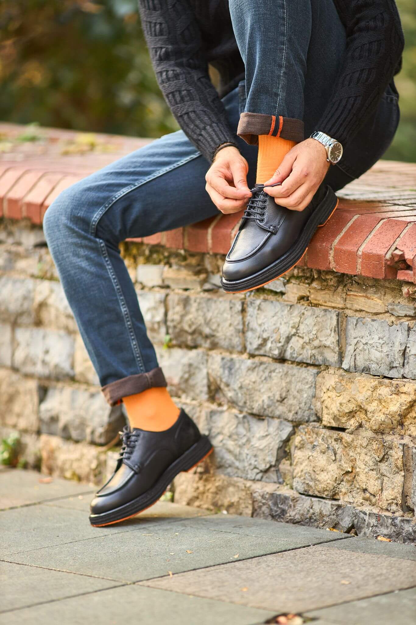 Men’s black leather derby shoes with moc-toe stitching and suede heel detail