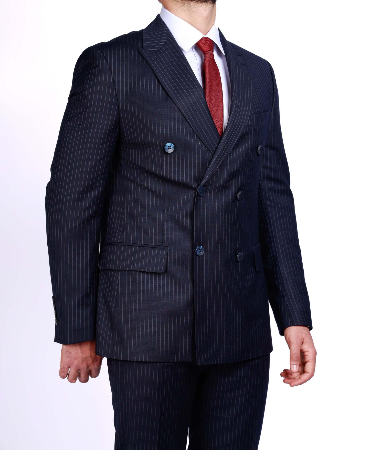 Men’s dark blue double-breasted pinstripe suit with peak lapels and slim-fit tailoring, worn with white shirt and red tie.