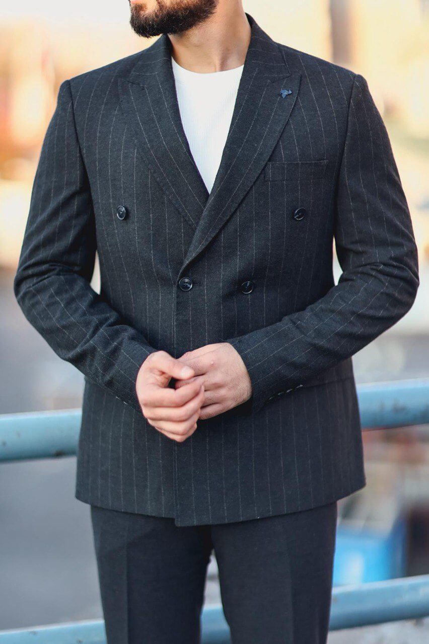 Men’s navy blue double-breasted pinstripe slim-fit suit styled with white knit top