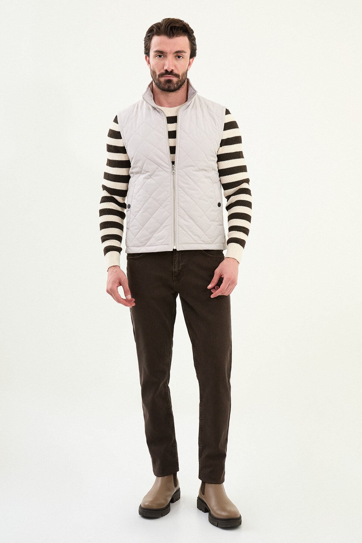 Light gray matte men’s technical utility vest with a stand collar, zip front, and two oversized snap-flap cargo pockets.