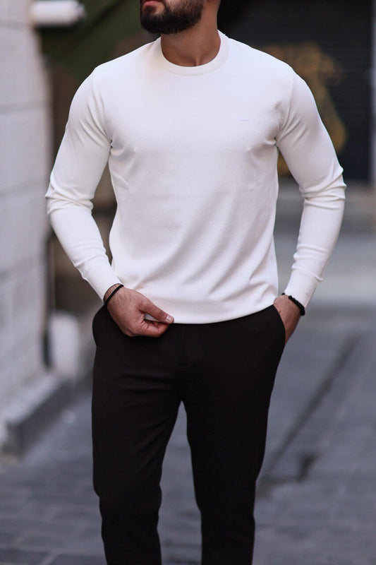 Men’s white slim-fit crew neck knitwear paired with black trousers