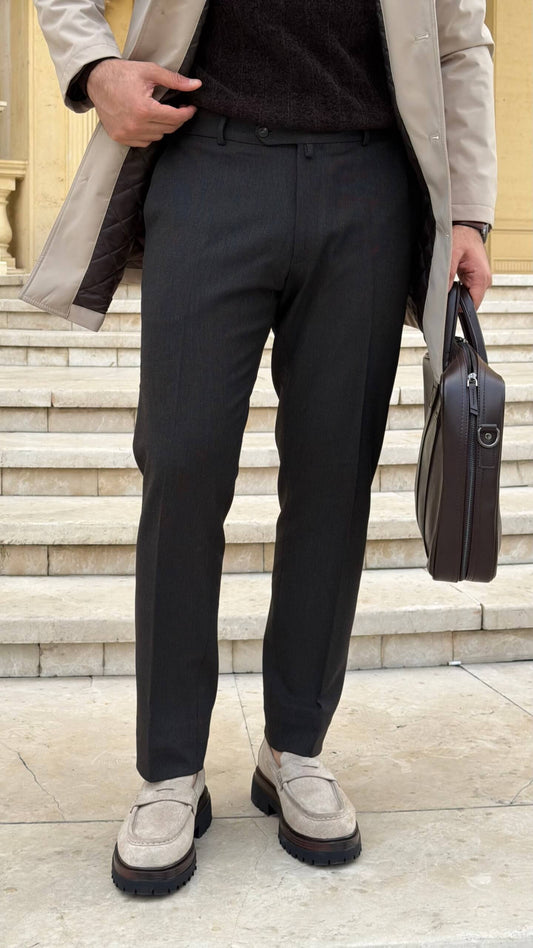 Men’s gray tailored trousers with slim fit design styled with beige loafers for fall winter fashion