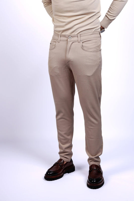 Men wearing beige slim fit stretch trousers with brown leather loafers