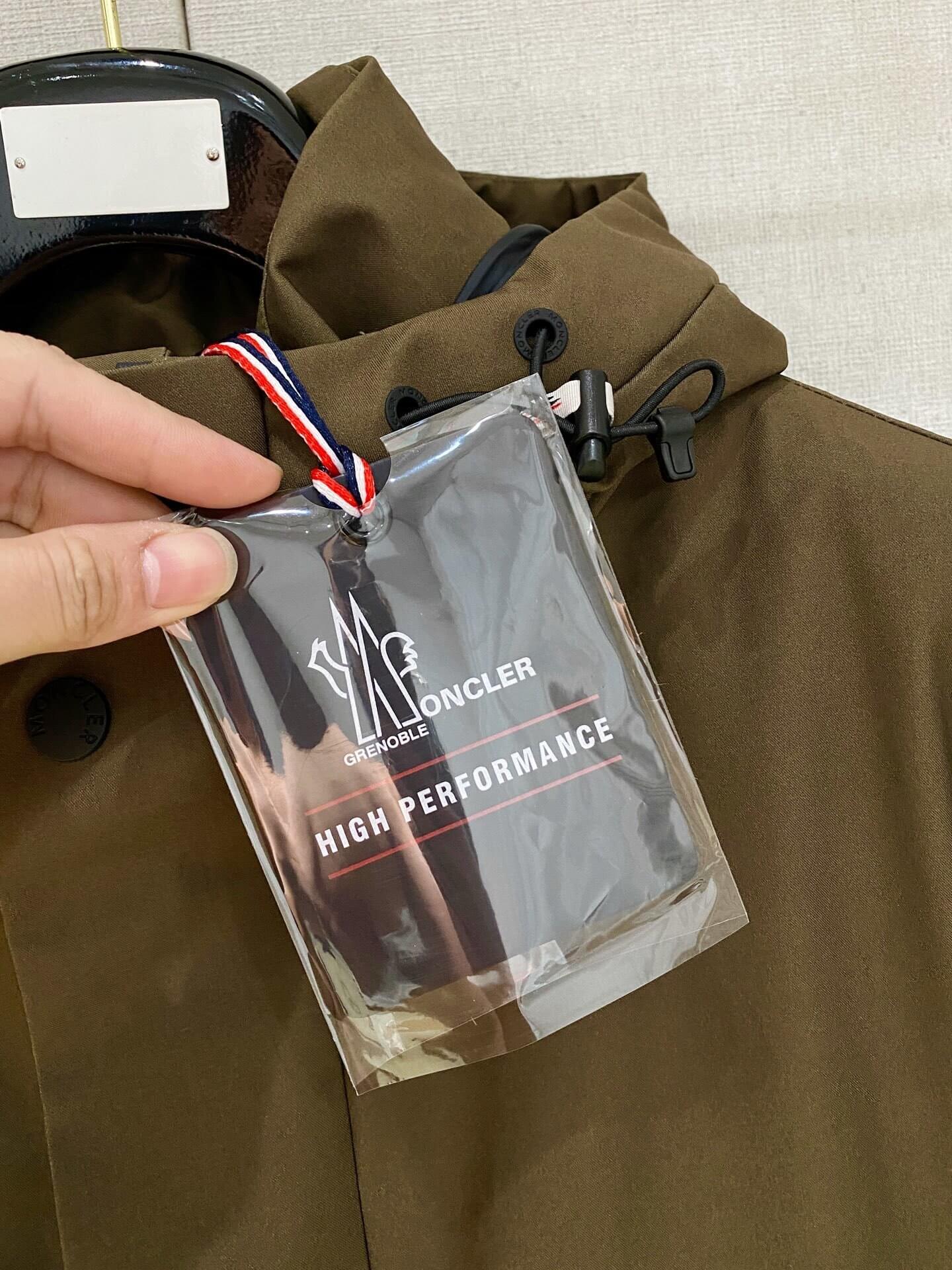 Brown ski down jacket with black insulated lining and hood, Moncler Grenoble-inspired design.