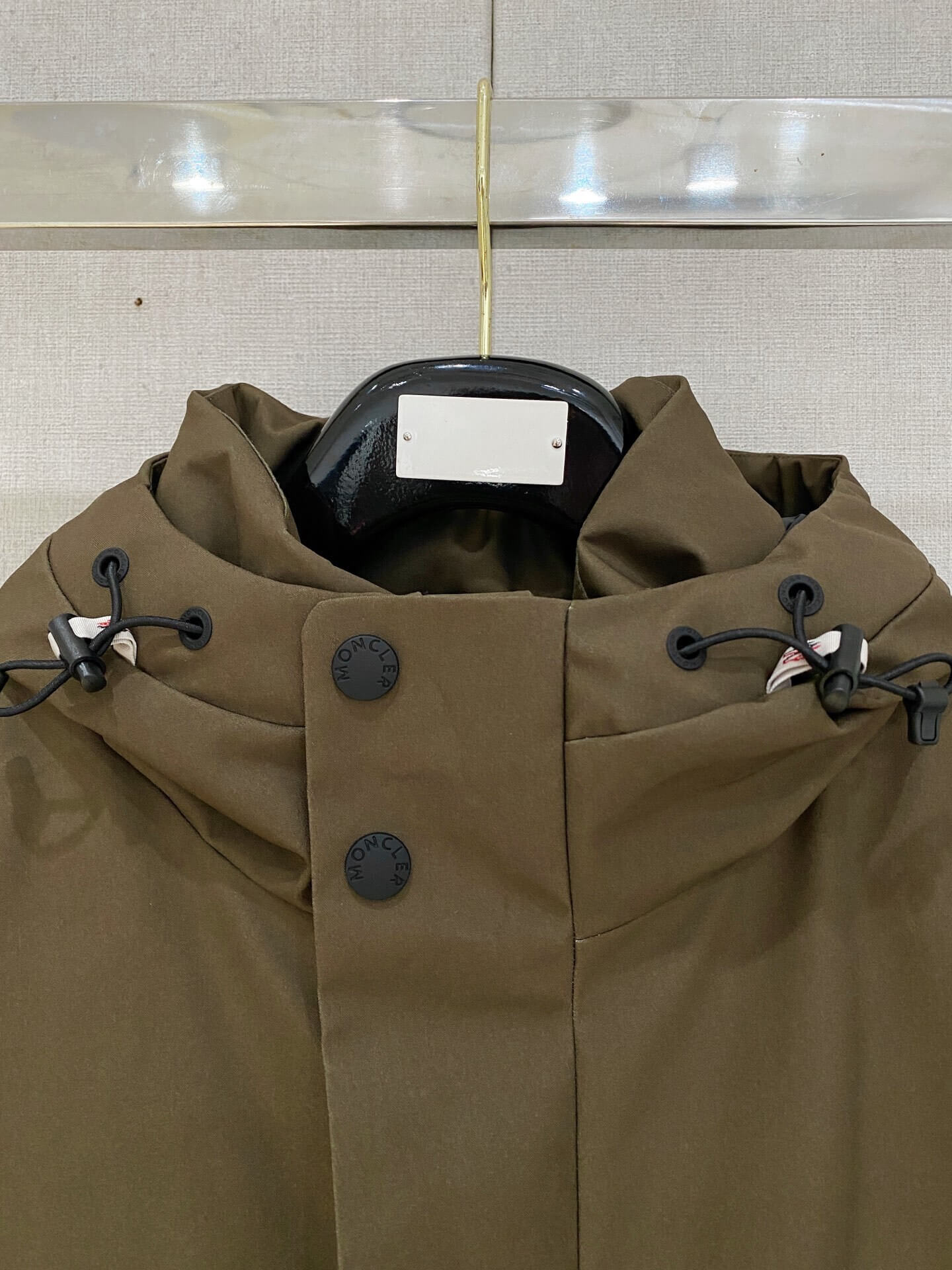 Brown ski down jacket with black insulated lining and hood, Moncler Grenoble-inspired design.