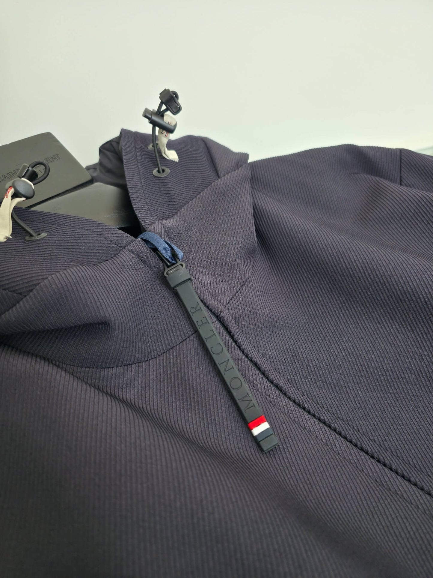 Navy hooded technical jacket with full zip closure and zippered pockets, Moncler-inspired design