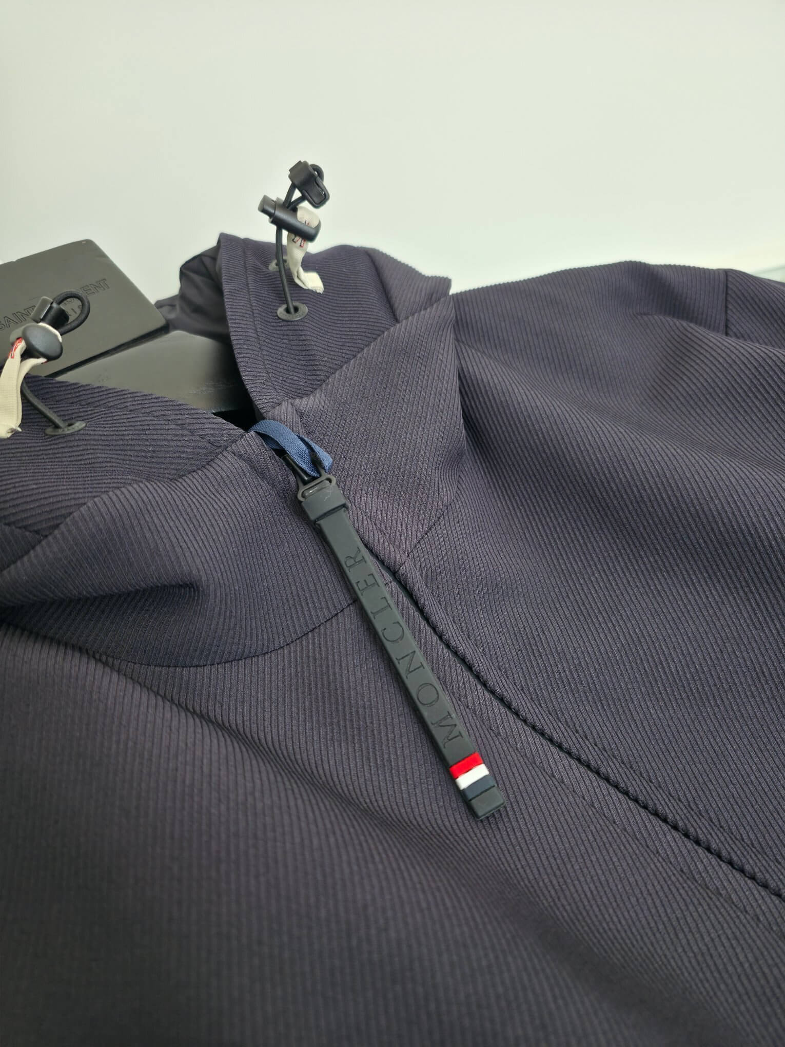 Navy hooded technical jacket with full zip closure and zippered pockets, Moncler-inspired design