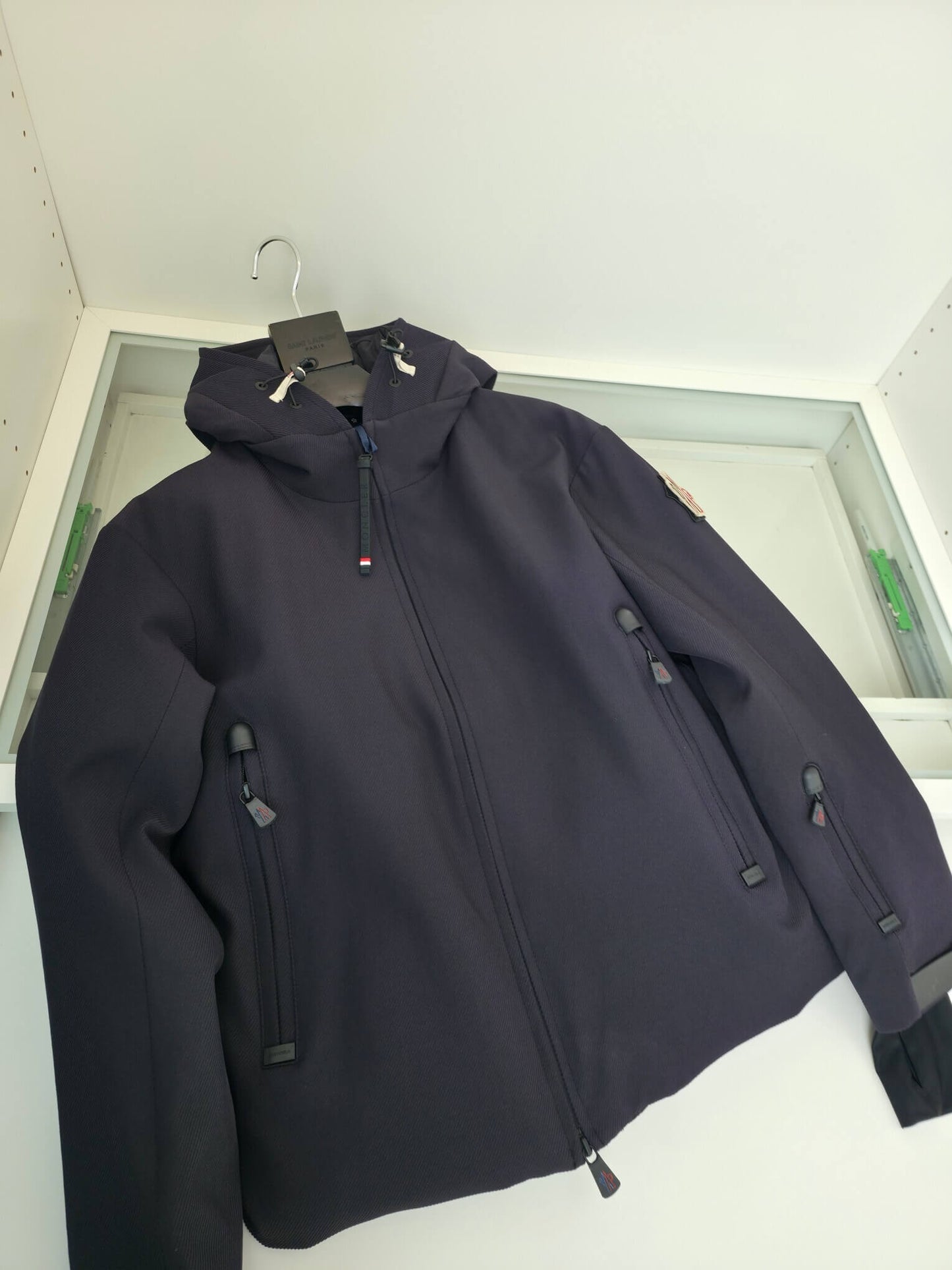 Navy hooded technical jacket with full zip closure and zippered pockets, Moncler-inspired design