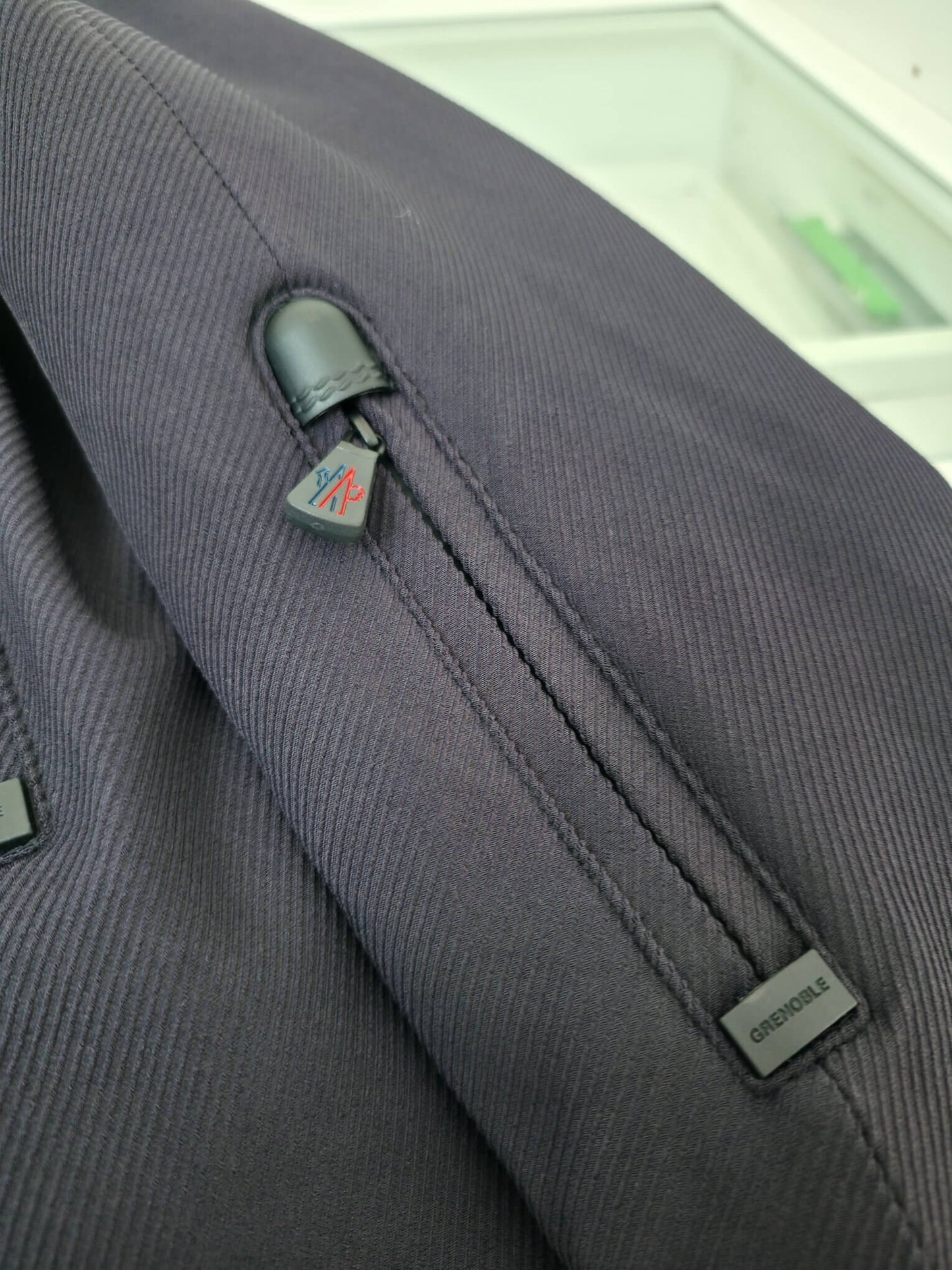 Navy hooded technical jacket with full zip closure and zippered pockets, Moncler-inspired design