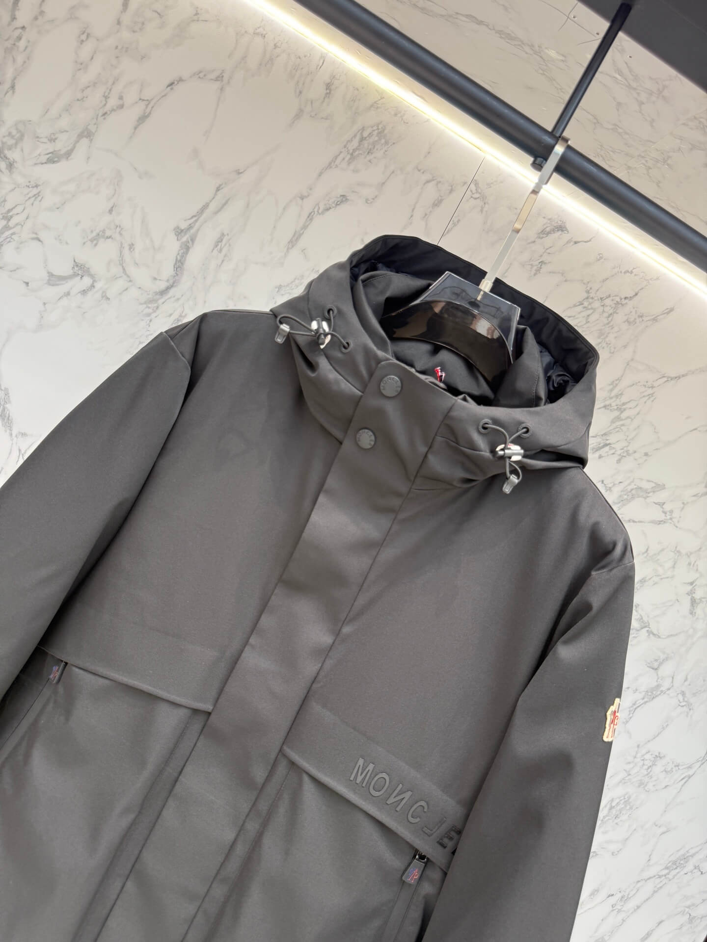 Moncler Maya Black Short Down Jacket open view showing quilted interior and label.