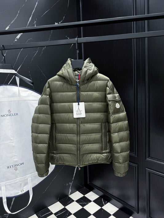 Green hooded glossy down jacket with quilted panels and zippered pockets, Moncler Maya-inspired design.
