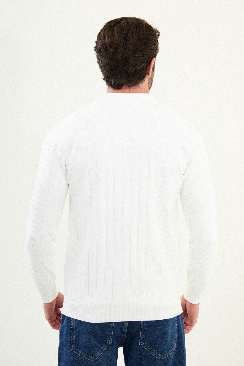 Men’s stark white slim-fit ribbed long-sleeve polo sweater with three-button placket and tonal buttons, cotton-viscose-elastane blend, styled with dark denim.