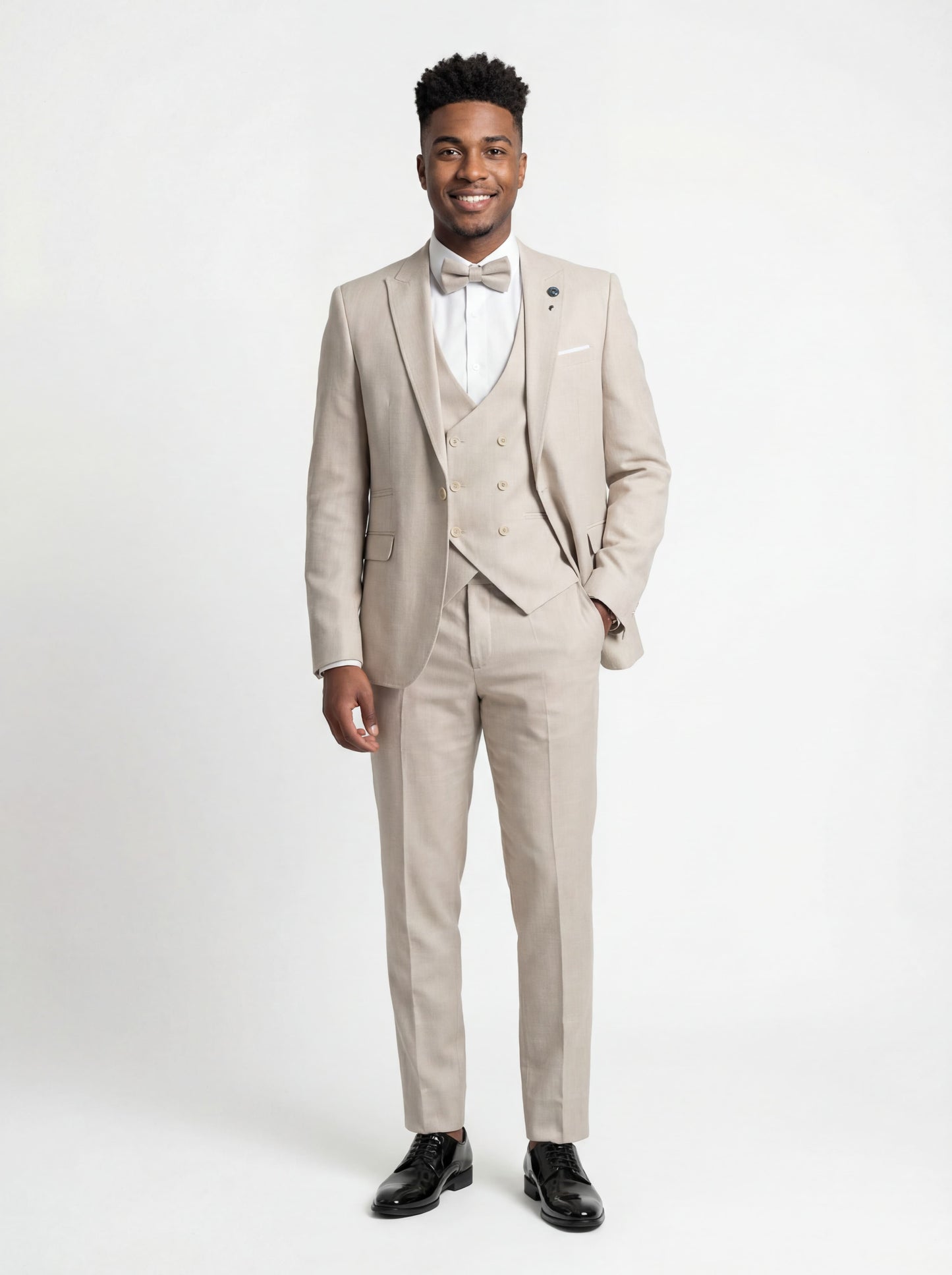 Ravishing Beige Teen Prom Tuxedo - Teen model wearing a slim fit beige tuxedo with bow tie, standing confidently at a formal event.