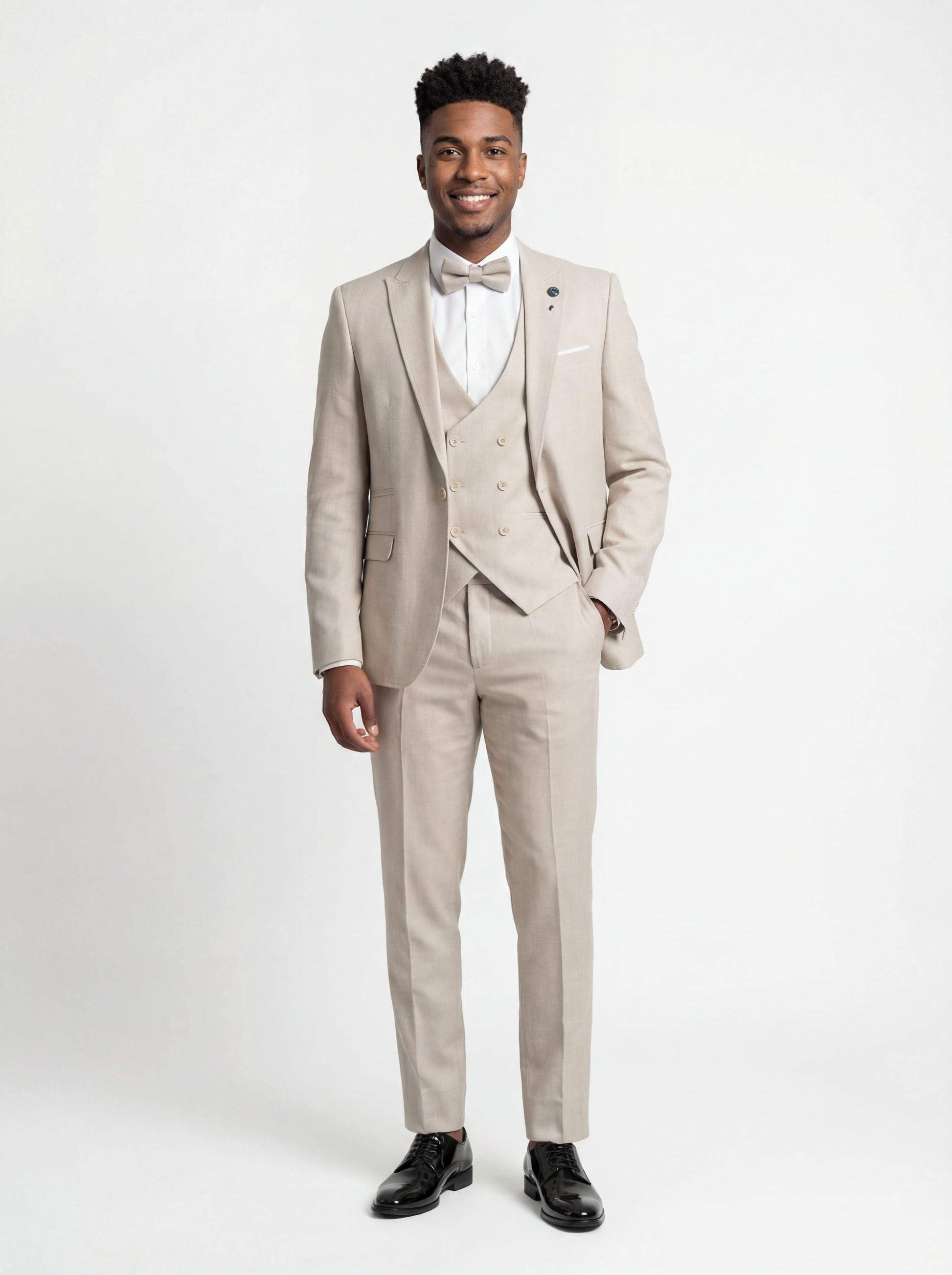 Ravishing Beige Teen Prom Tuxedo - Teen model wearing a slim fit beige tuxedo with bow tie, standing confidently at a formal event.