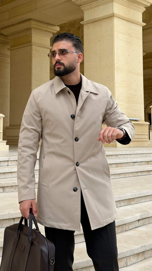 Men wearing a beige single breasted trench coat with button closure and side pockets