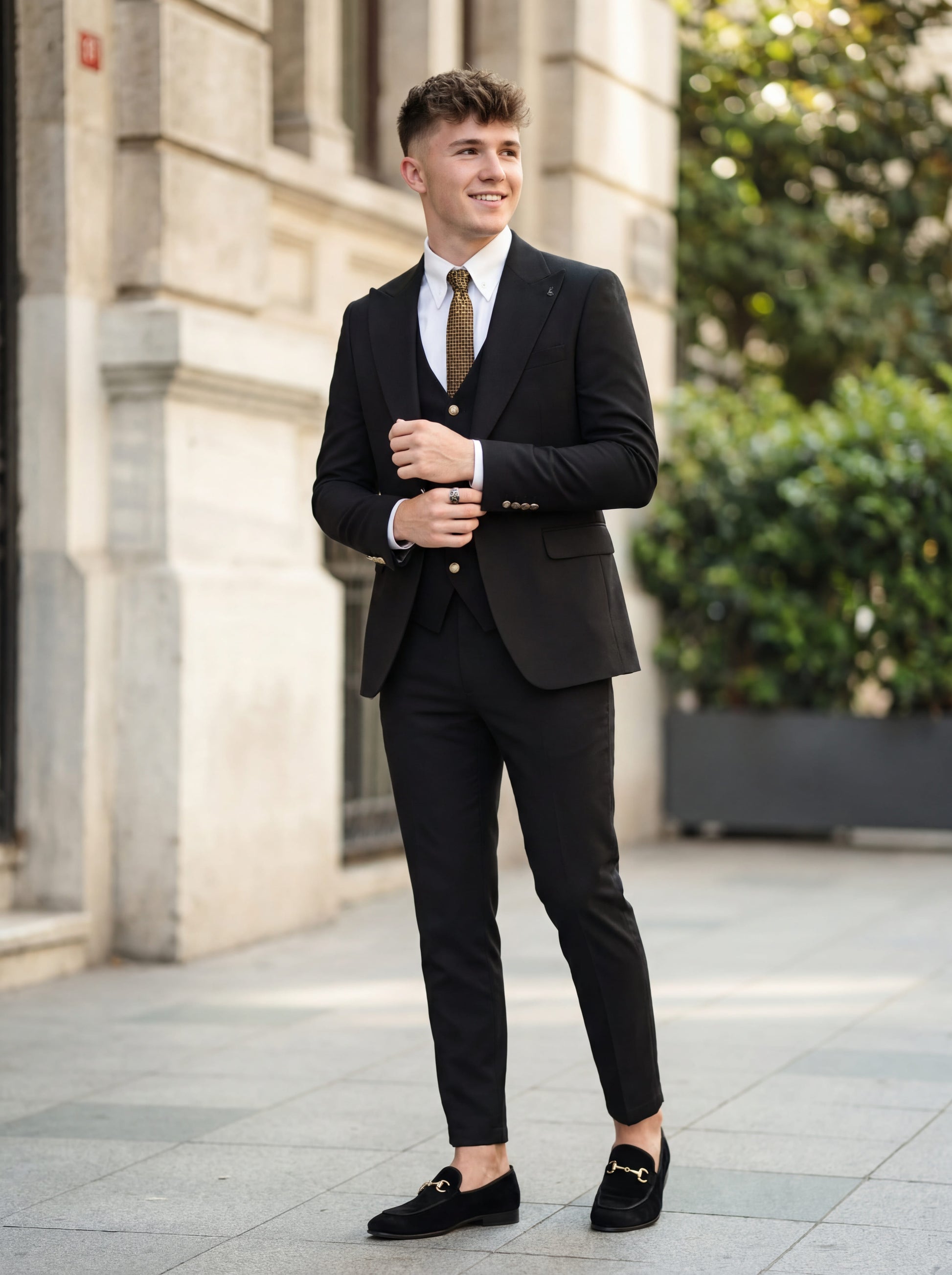 Model in Elegant Black Slim Fit 3-Piece Prom Suit standing outdoors with confident smile.