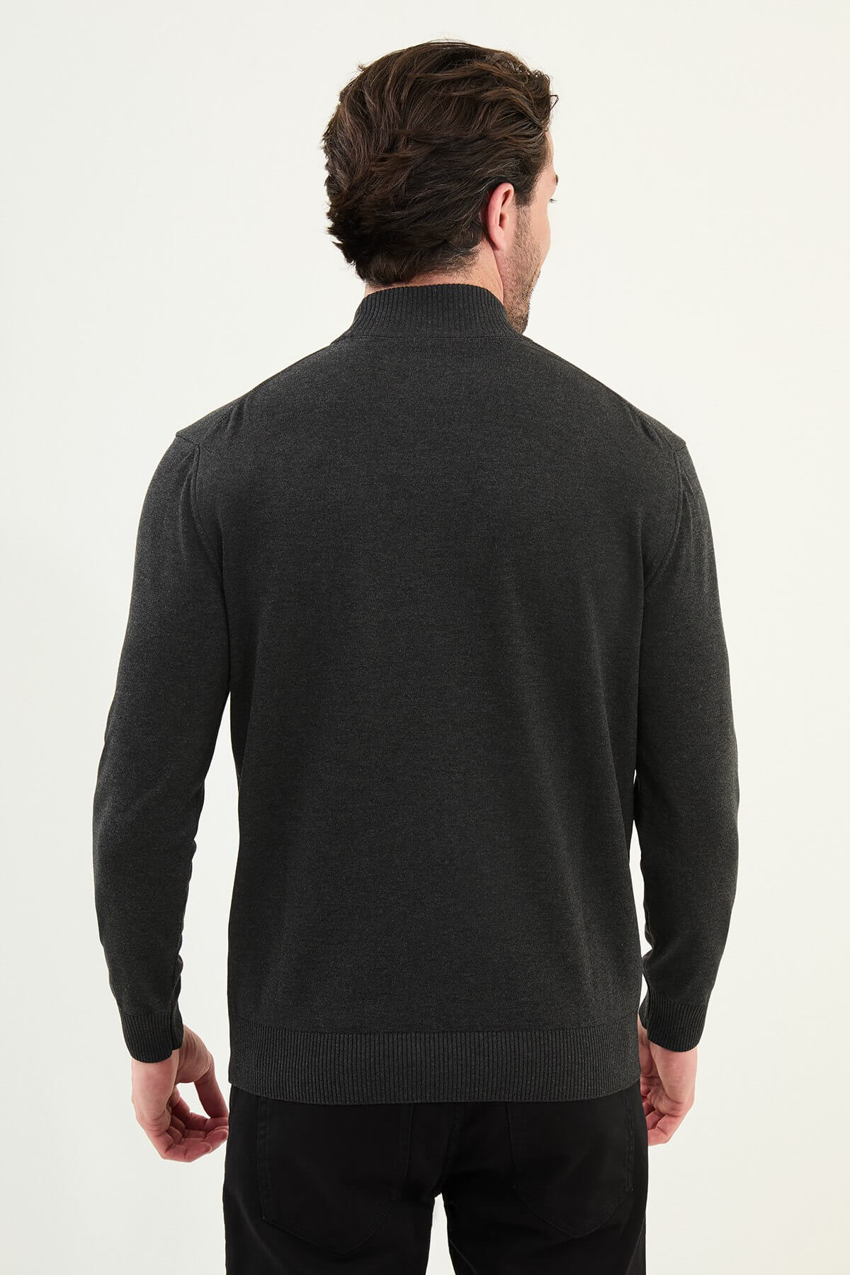 Man wearing a dark gray slim fit half-turtleneck sweater from the Fall-Winter collection.
