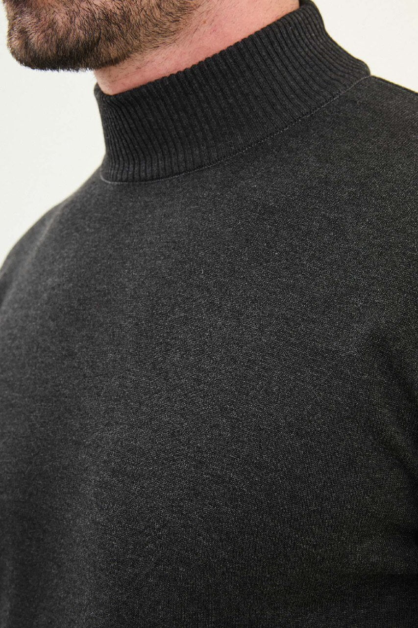 Man wearing a dark gray slim fit half-turtleneck sweater from the Fall-Winter collection.