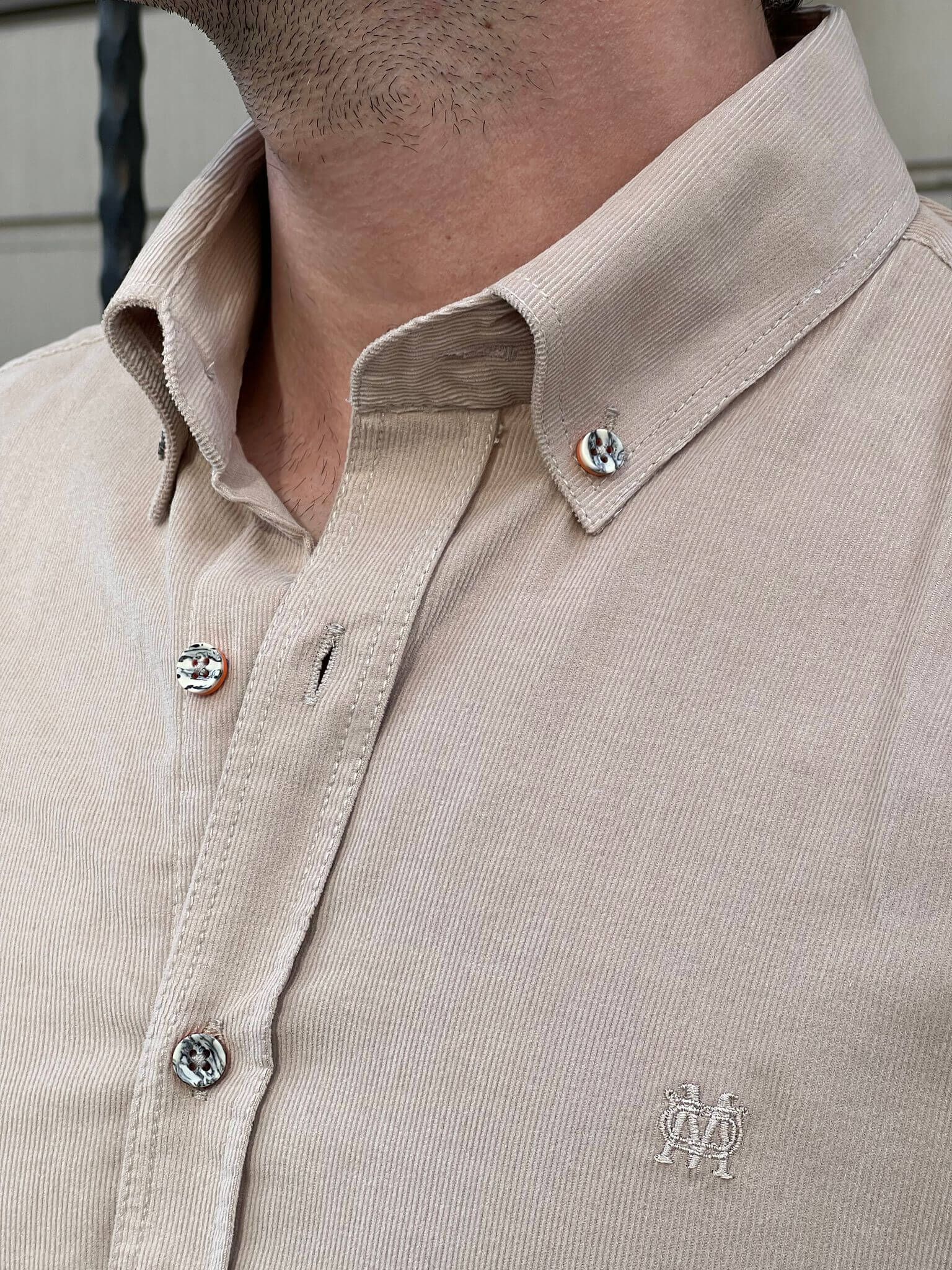 Our male model effortlessly flaunts the Velvet Beige Shirt, epitomizing refined style.