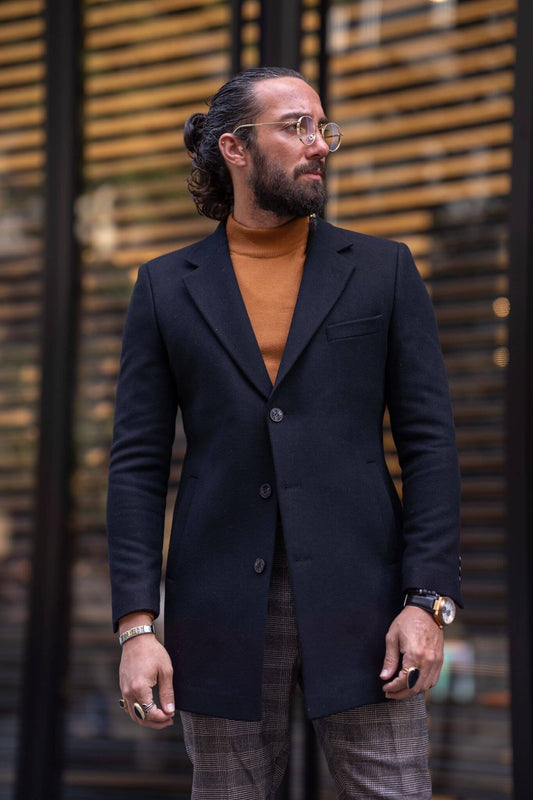 A male model exudes sophistication while showcasing the timeless elegance of the Cashmere Black Coat, epitomizing luxury and style