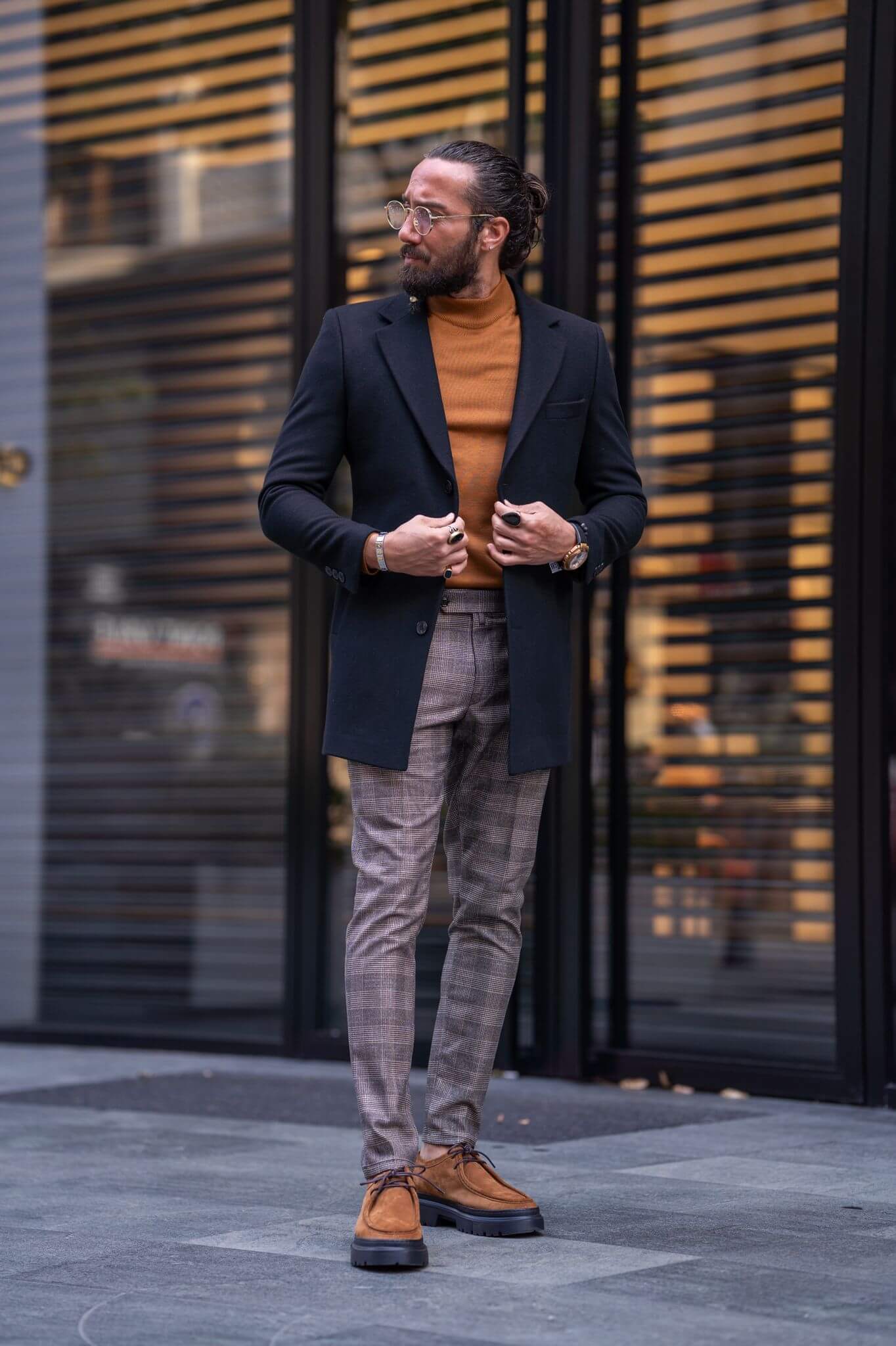 A male model exudes sophistication while showcasing the timeless elegance of the Cashmere Black Coat, epitomizing luxury and style