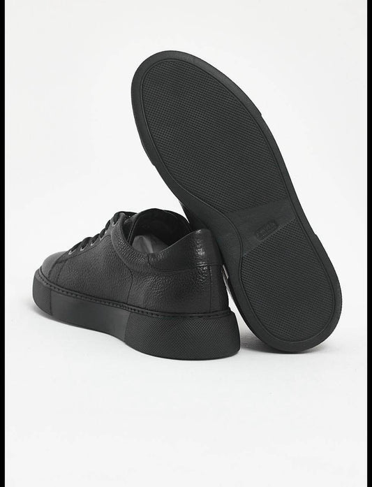 Black leather sneakers with textured floater leather and matching black EVA sole. 